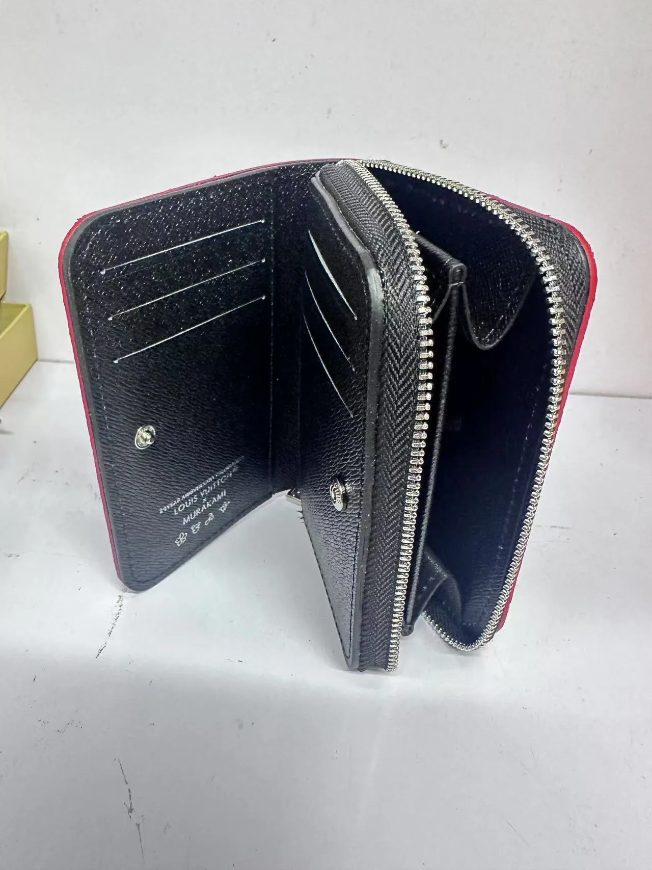 P150 M83689 This Cléa wallet is made of Monogram Empreinte soft grained cowhide, embellished with Louis Vuitton's iconic Monogram embossed pattern. It has a stylish design, is compact yet spacious, and is equipped with an external patch pocket, zipper coin pocket, banknote compartment and six credit card slots.