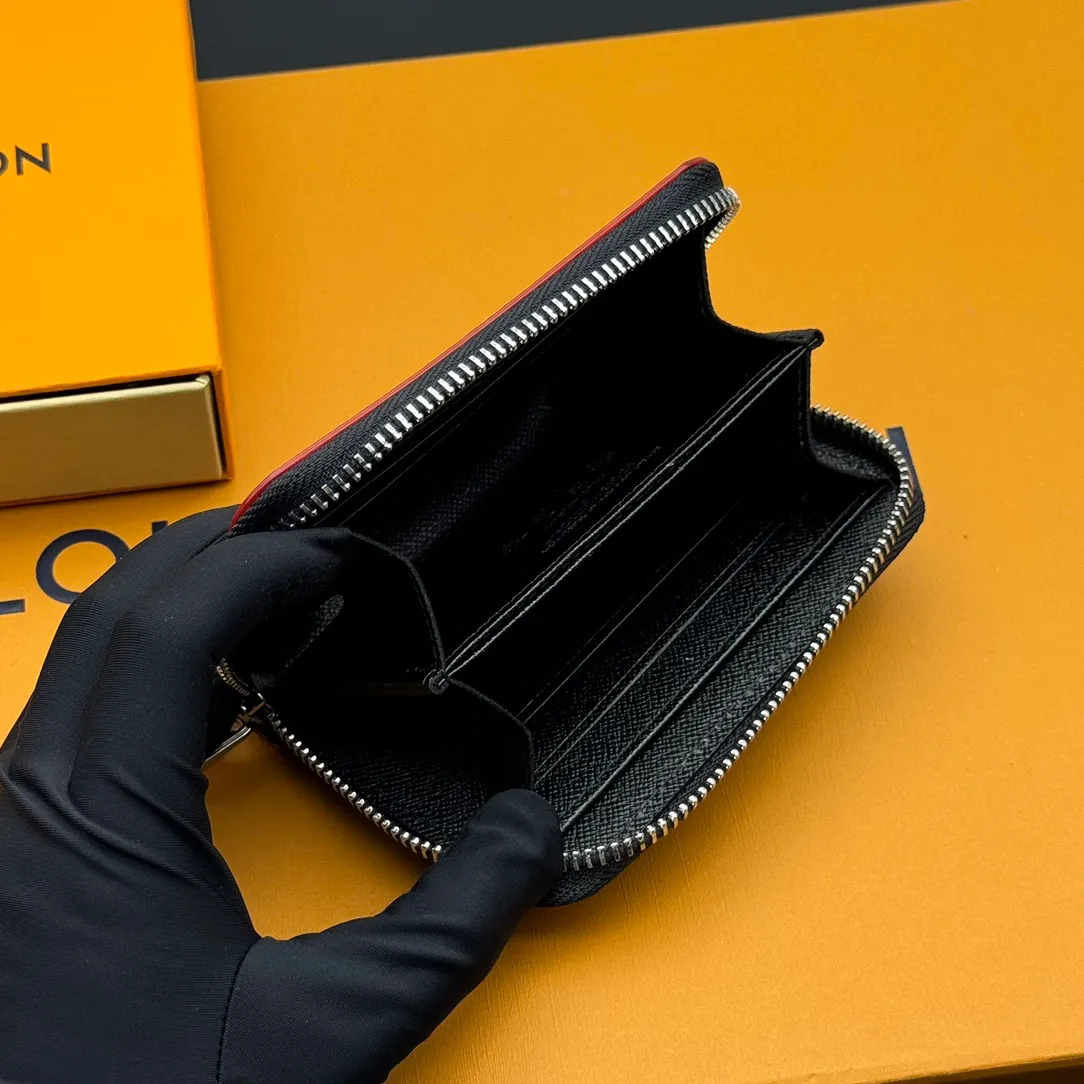 💰110 💎Premium Original 🇫🇷 LV x TM Zippy Coin Purse Black (Three Colors - Takashi Murakami) As part of the Louis Vuitton x Murakami collection reissue, the timeless Zippy Coin Purse is practical and playful, upgraded for this season. It's made from Monogram coated canvas in a cheerful rainbow of hues, in keeping with the Japanese artist's signature pop palette. The interior is secured with a silver zipper and is divided into multiple compartments for coins, banknotes and cards. Model: M13409 Dimensions: 11 x 8.5 x 2 cm.
