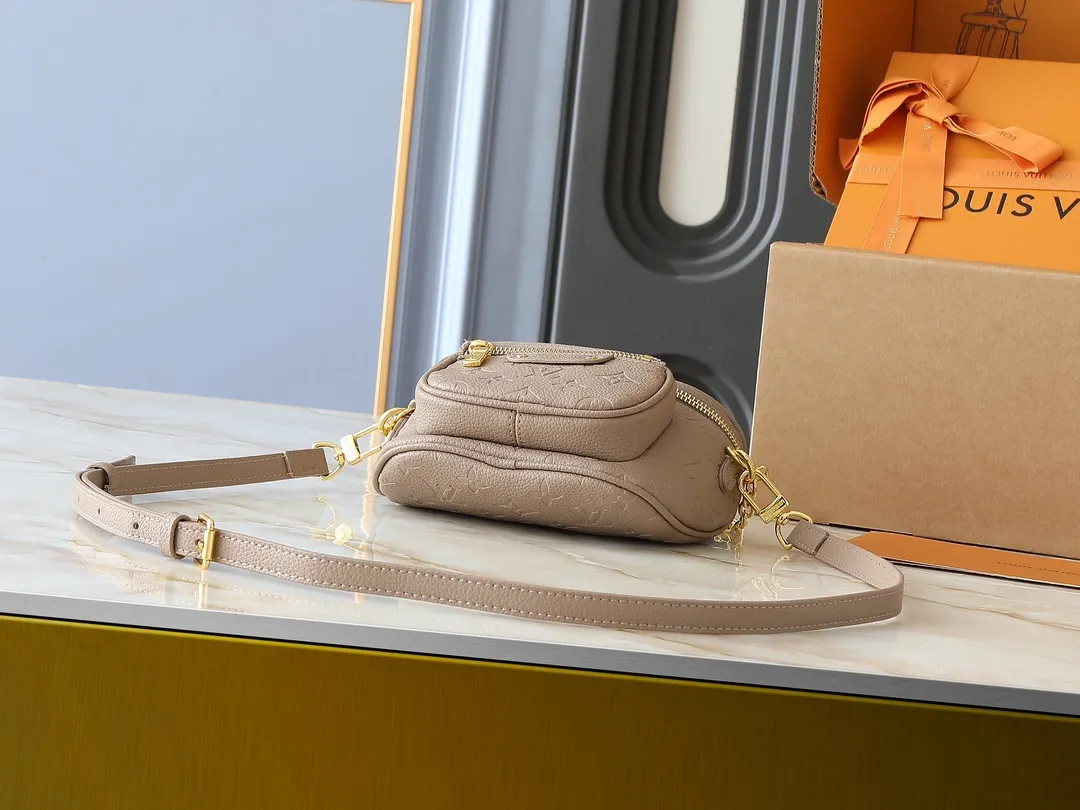 💰200💰Upgraded from the original M46917 M82335 M83275 M82208 M82347 This Mini Bumbag handbag comes from the LV Gradient series and uses the Monogram embossing of Monogram Empreinte leather to render gradient midsummer colors. The on-trend construction features a zipped main compartment and a front pocket with a Louis Vuitton leather label. With the detachable chain and detachable and adjustable shoulder strap, it can be worn as a shoulder or cross-body bag. 17.0 x 12.0 x 9.5 cm (L x H x W) • Monogram Empreinte embossed soft-grained cowhide leather • Textile lining • Metal hardware • Zip closure • Zip front pocket • Shoulder strap: removable, adjustable • Half-length strap: 32.0 cm • Half-length strap adjustable to: 44.0 cm • Chain: Removable • Half-length chain: 20.0 cm