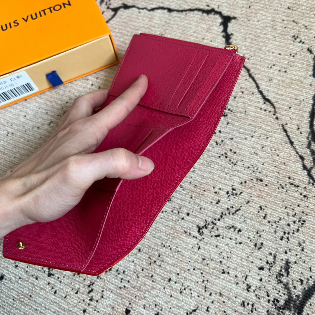 Factory price 340 Top original order M14163 white color This replica Victorine wallet from the Louis Vuitton x Murakami series is small and exquisite. The colorful Monogram pattern reinterprets Louis Vuitton's classic logo with the famous rainbow tones of Japanese artist Takashi Murakami. The wallet is made of coated canvas with fine cowhide lining and silver-tone hardware. It has a zippered coin compartment and multiple interior compartments for banknotes and business cards. 12 x 9.5 x 2.5 cm (length x height x width)