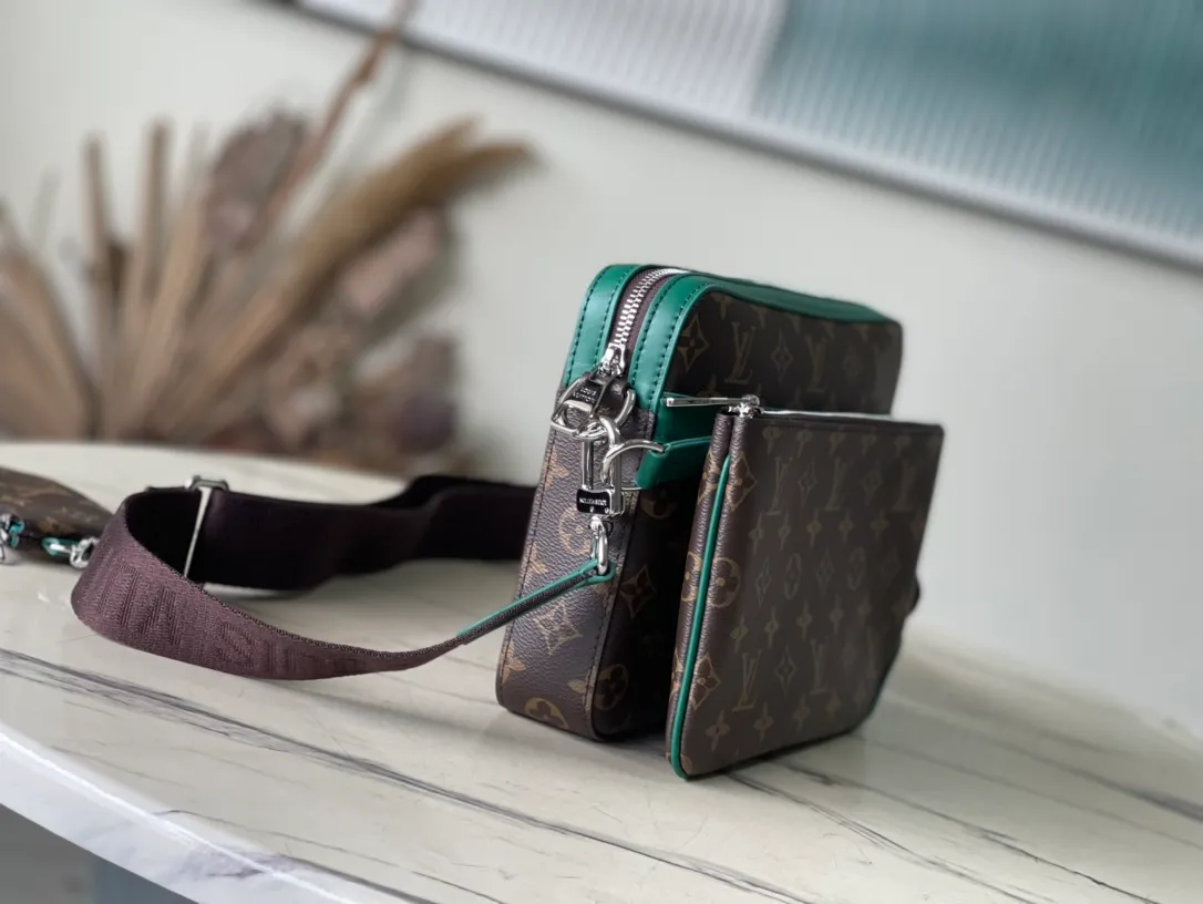 💰800 Top Original Order M12766 This Trio messenger bag is made of Monogram Macassar coated canvas, and then uses bright cow leather to outline the edges and other details. The main compartment and removable zippered front pocket provide storage, and the removable small coin purse secures via the shoulder strap's D-ring. Dimensions: 25 × 18.5 × 7cm