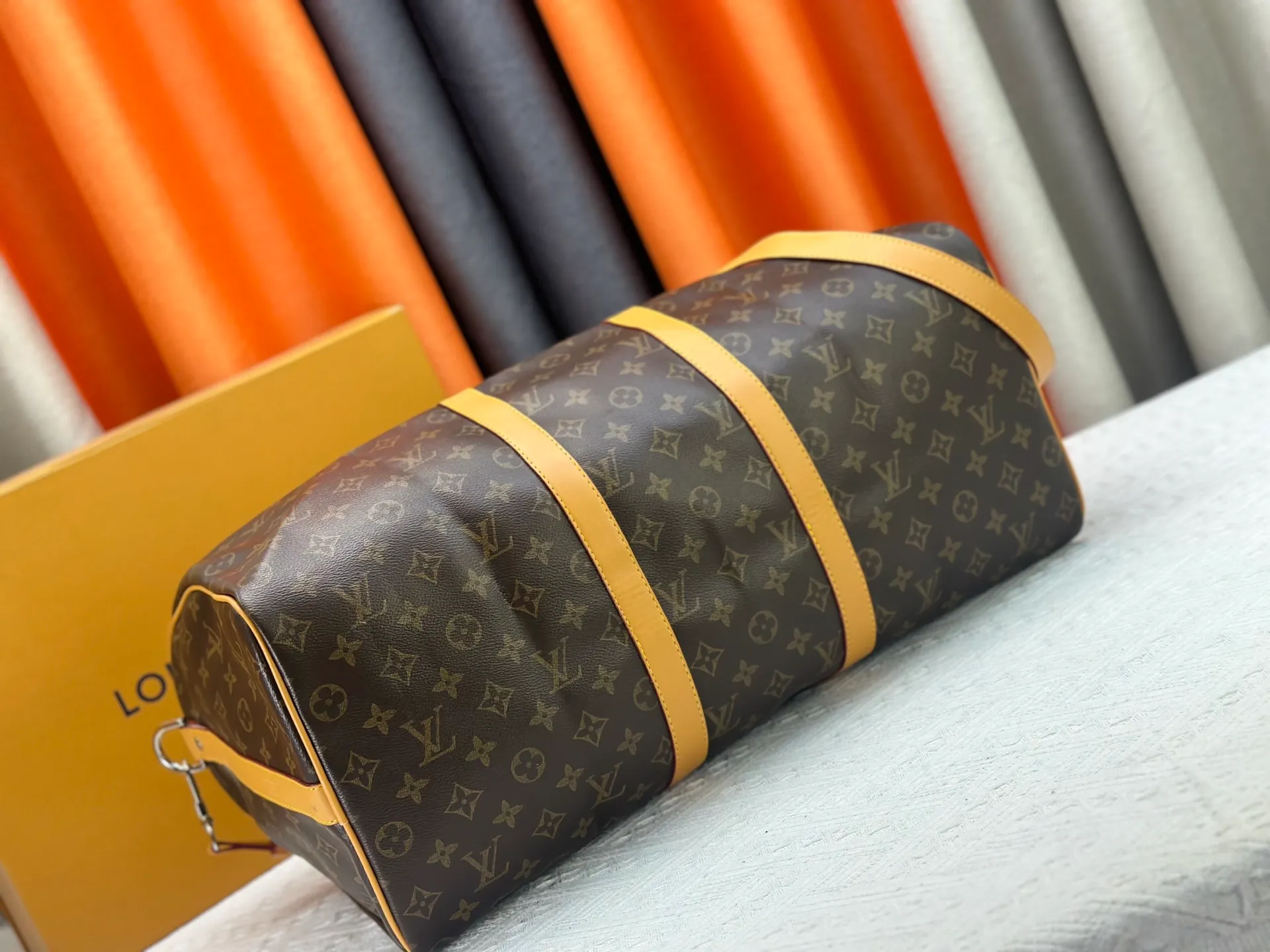 P360 Upgraded Original M41416 M12634 Yellow M12633 Dark Blue M12629 Light Blue M12630 Dark Green Top Original This Keepall Bandoulière 50 travel bag is made of Monogram Macassar canvas, which simultaneously renders bright colors for the side straps, nameplate, fabric lining and top leather handle. The size of your carry-on luggage hides plenty of space. 50.0 x 29.0 x 23.0 cm (L x H x W) • Monogram Macassar coated canvas • Cow leather trim • Textile lining • Metal hardware • Carry-on dimensions • Double zipper closure • Padlock • Removable name tag • Internal zip pocket • Shoulder strap: removable, adjustable • Half-length strap: 36.0 cm • Half-length strap adjustable to: 50.0 cm • Handle: Double handle