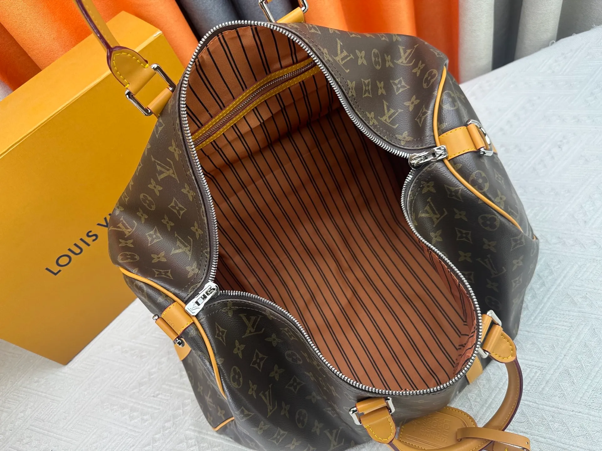 P360 Upgraded Original M41416 M12634 Yellow M12633 Dark Blue M12629 Light Blue M12630 Dark Green Top Original This Keepall Bandoulière 50 travel bag is made of Monogram Macassar canvas, which simultaneously renders bright colors for the side straps, nameplate, fabric lining and top leather handle. The size of your carry-on luggage hides plenty of space. 50.0 x 29.0 x 23.0 cm (L x H x W) • Monogram Macassar coated canvas • Cow leather trim • Textile lining • Metal hardware • Carry-on dimensions • Double zipper closure • Padlock • Removable name tag • Internal zip pocket • Shoulder strap: removable, adjustable • Half-length strap: 36.0 cm • Half-length strap adjustable to: 50.0 cm • Handle: Double handle
