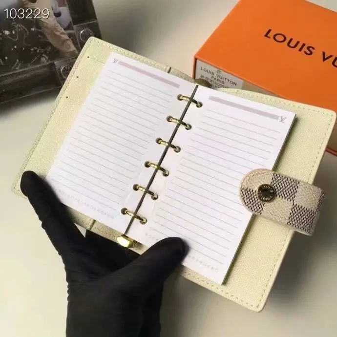 P140 Hot item shipped, model number M20005. This small notepad cover is made of Monogram canvas. It can hold three credit cards and can also be used as an address book, notebook or calendar. 10/12 cm (Length x Height) - Epi leather embossed with delicate LV initials and lined with interwoven textured leather - Button closure - Six-ring binder with three rings in sets, six credit card slots and two internal compartments - Notepad insert available separately