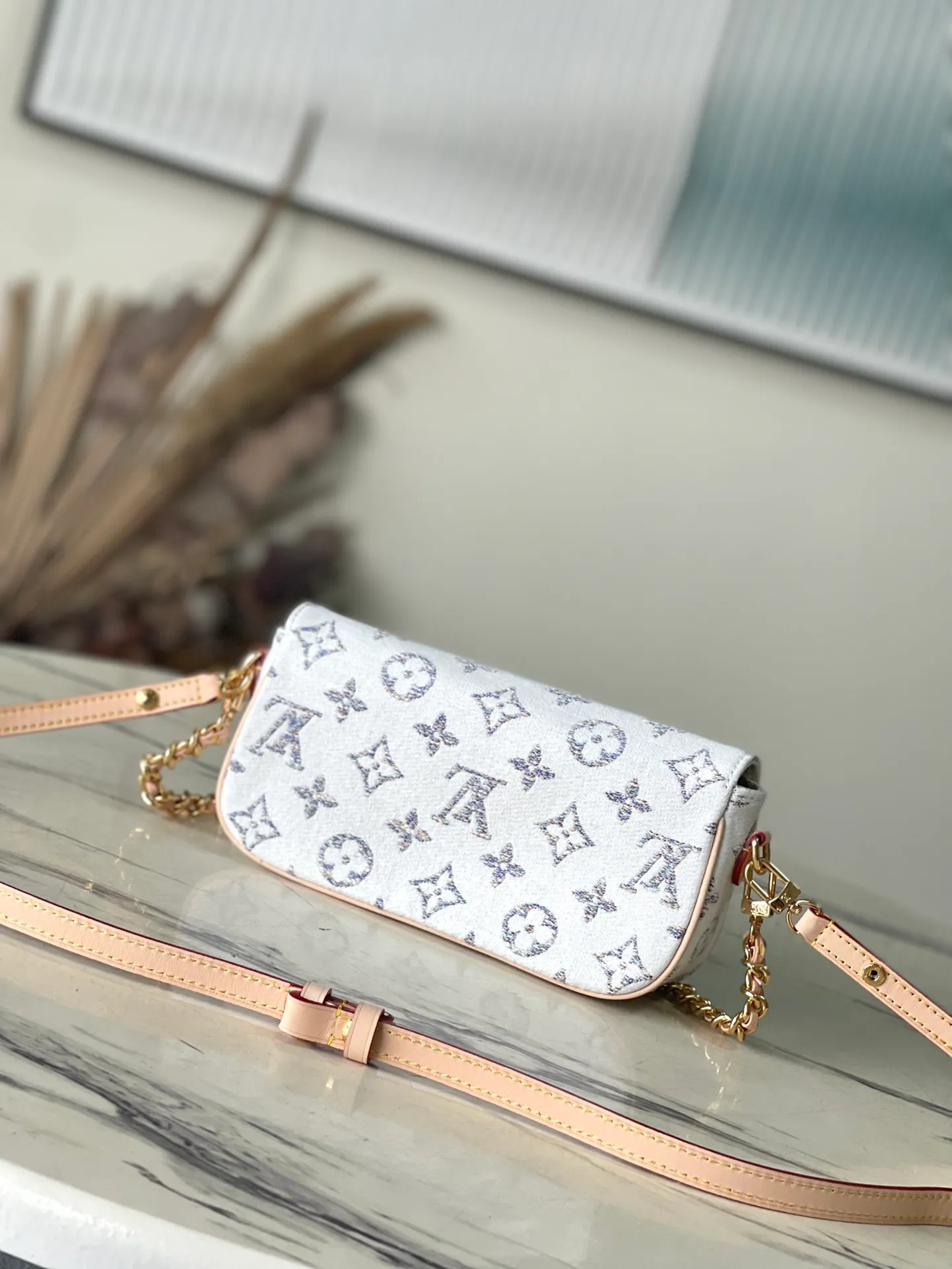 💰900 Top Original Order M83499 This Wallet on Chain Ivy handbag opens with a magnetic flap and has a rounded rectangular body, presenting a modern interpretation of a mini handbag. Monogram jacquard fabric traces the texture of tweed and is offset by leather trim. The adjustable leather shoulder strap and lace-up chain are both removable, allowing for a variety of styling possibilities. Dimensions: 23.5 x 12 x 4.3 cm (length x height x width)