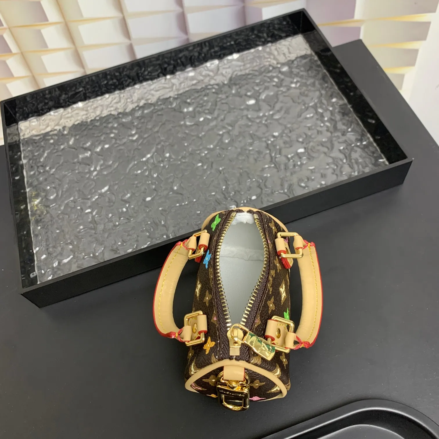 💰200 shipped😍 MINI KEEPALL bag charm and keychain ☀️Louis Vuitton Louis Vuitton lv mini pillow bag pendant ☀️This Mini Keepall bag charm and keychain condenses the classic handbag configuration, boldly showing the spirit of adventure. Monogram canvas with LV inscribed hook buckle, whether hung on a belt or handbag, its zipper closure and built-in keychain ensure secure storage