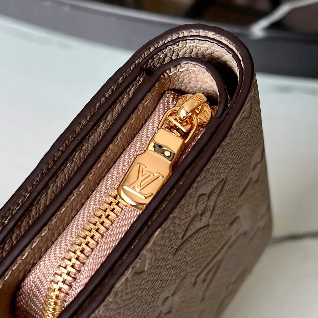 Factory price 480 Top original order M80152 Apricot This Cléa wallet is made of Monogram Empreinte soft grained cowhide, embellished with Louis Vuitton's iconic Monogram embossed pattern. It has a stylish design, is exquisite and compact but has a spacious capacity. It is equipped with an external patch pocket, zipper coin pocket, banknote compartment and six credit card slots. Details 12 x 9 x 3.5 cm (Length x Height x Width) Turtledove beige Soft grained embossed cowhide Leather lining Gold-tone hardware Snap-button closure Compartment for notes Accordion zip coin pocket External patch pocket Inner card compartment 6 credit card slots