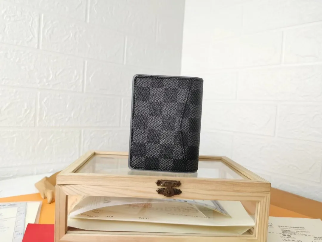 P110💰Top Original💎N63144 black check with yellow, this pocket wallet combines the elegance of Damier Graphite canvas with the delicate texture of Epi leather, with stripes emblazoned with the Louis Vuitton logo. The elegant design can accommodate credit cards, banknotes and receipts, making it suitable for daily carrying or gift giving. Detailed Features 8.0 x 11.0 x 1.0 cm (L x H x W) Epi leather and Damier Graphite coated canvas Coated cowhide leather trim Cowhide lining, card compartment, inner pocket, outer patch pocket This product is made in one of France, Spain, Italy and the United States