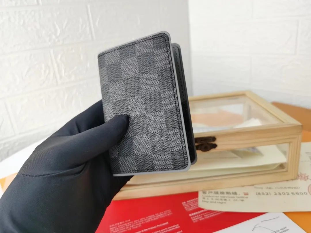 P110💰Top Original💎N63144 black check with yellow, this pocket wallet combines the elegance of Damier Graphite canvas with the delicate texture of Epi leather, with stripes emblazoned with the Louis Vuitton logo. The elegant design can accommodate credit cards, banknotes and receipts, making it suitable for daily carrying or gift giving. Detailed Features 8.0 x 11.0 x 1.0 cm (L x H x W) Epi leather and Damier Graphite coated canvas Coated cowhide leather trim Cowhide lining, card compartment, inner pocket, outer patch pocket This product is made in one of France, Spain, Italy and the United States