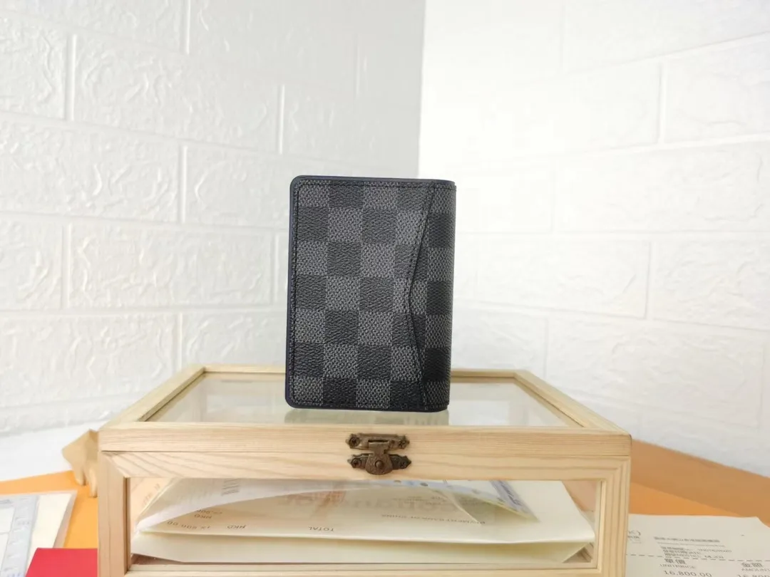 P110💰Top Original💎N63144 black check with yellow, this pocket wallet combines the elegance of Damier Graphite canvas with the delicate texture of Epi leather, with stripes emblazoned with the Louis Vuitton logo. The elegant design can accommodate credit cards, banknotes and receipts, making it suitable for daily carrying or gift giving. Detailed Features 8.0 x 11.0 x 1.0 cm (L x H x W) Epi leather and Damier Graphite coated canvas Coated cowhide leather trim Cowhide lining, card compartment, inner pocket, outer patch pocket This product is made in one of France, Spain, Italy and the United States