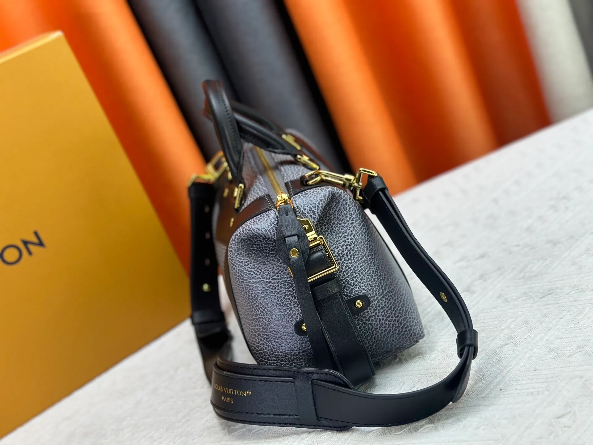 P300 small P320 medium P340 large M25557 M25561 M25561 M25566 Black M14623 mini M14514 small M14700 medium Dark gray M14702 medium Light gray M14721 small This Nano LV Rider handbag is from 2025 For the spring and summer series, pixelated grained sheep leather is blended with smooth cow leather elements, and the LV Circle logo is highlighted with elegant patches. The foldable configuration makes it easy to store in a suitcase, and the modern design adds a rock-n-roll edge to any look.  Mini 10 x 10 x 23 cm Small 12 × 12 × 30 cm Medium 15 × 15 × 38 cm (H x W x L) Sheep leather Cow leather trim Textile lining Metal hardware Zipper closure Side slip straps Internal pocket Holds a 6.7-inch smartphone, Romy card holder and lipstick Shoulder strap: removable, adjustable Strap half-length: 30.0 cm Bag strap half length adjustable to: 45.0 cm Handle: double handle