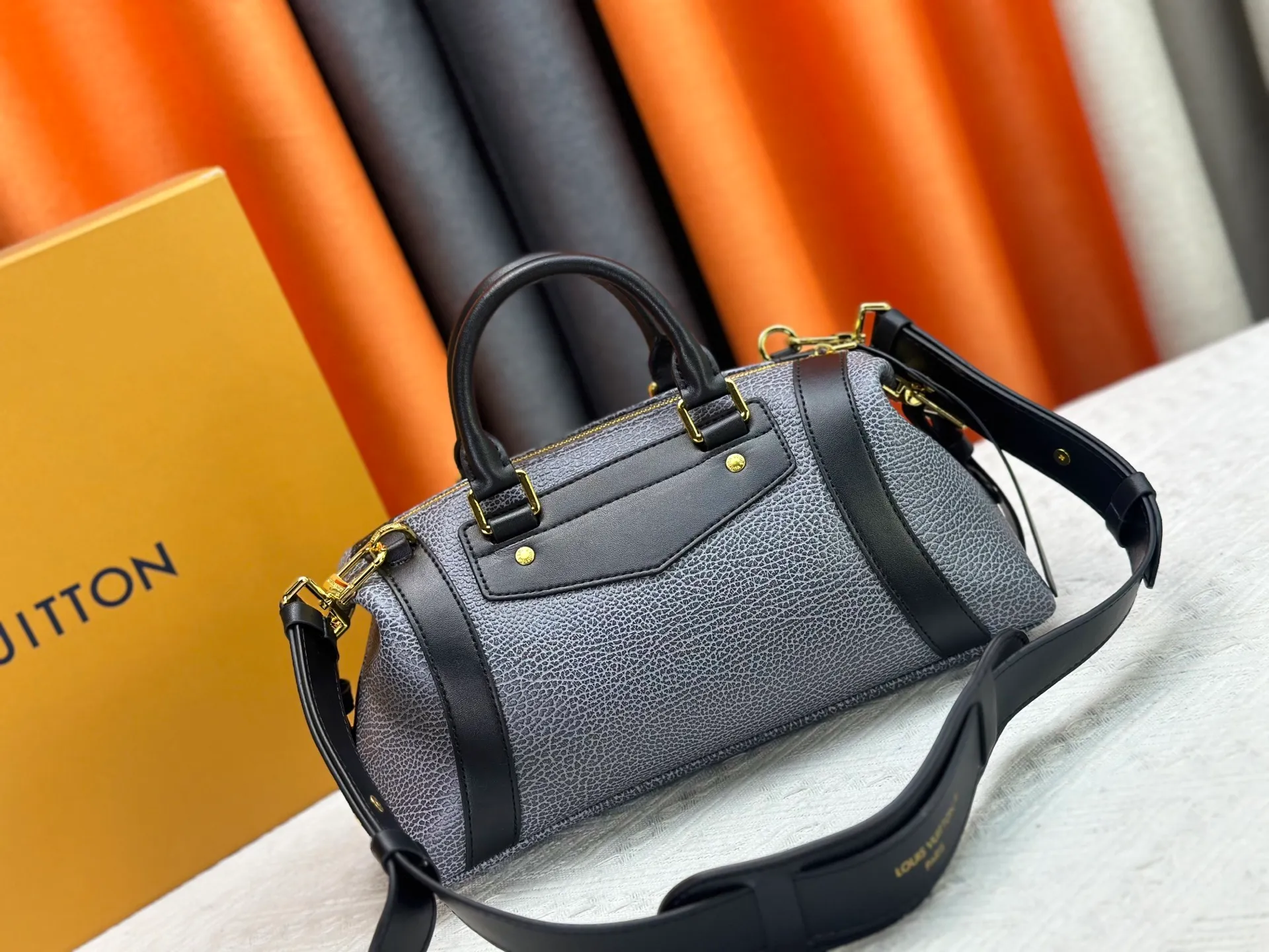 P300 small P320 medium P340 large M25557 M25561 M25561 M25566 Black M14623 mini M14514 small M14700 medium Dark gray M14702 medium Light gray M14721 small This Nano LV Rider handbag is from 2025 For the spring and summer series, pixelated grained sheep leather is blended with smooth cow leather elements, and the LV Circle logo is highlighted with elegant patches. The foldable configuration makes it easy to store in a suitcase, and the modern design adds a rock-n-roll edge to any look.  Mini 10 x 10 x 23 cm Small 12 × 12 × 30 cm Medium 15 × 15 × 38 cm (H x W x L) Sheep leather Cow leather trim Textile lining Metal hardware Zipper closure Side slip straps Internal pocket Holds a 6.7-inch smartphone, Romy card holder and lipstick Shoulder strap: removable, adjustable Strap half-length: 30.0 cm Bag strap half length adjustable to: 45.0 cm Handle: double handle