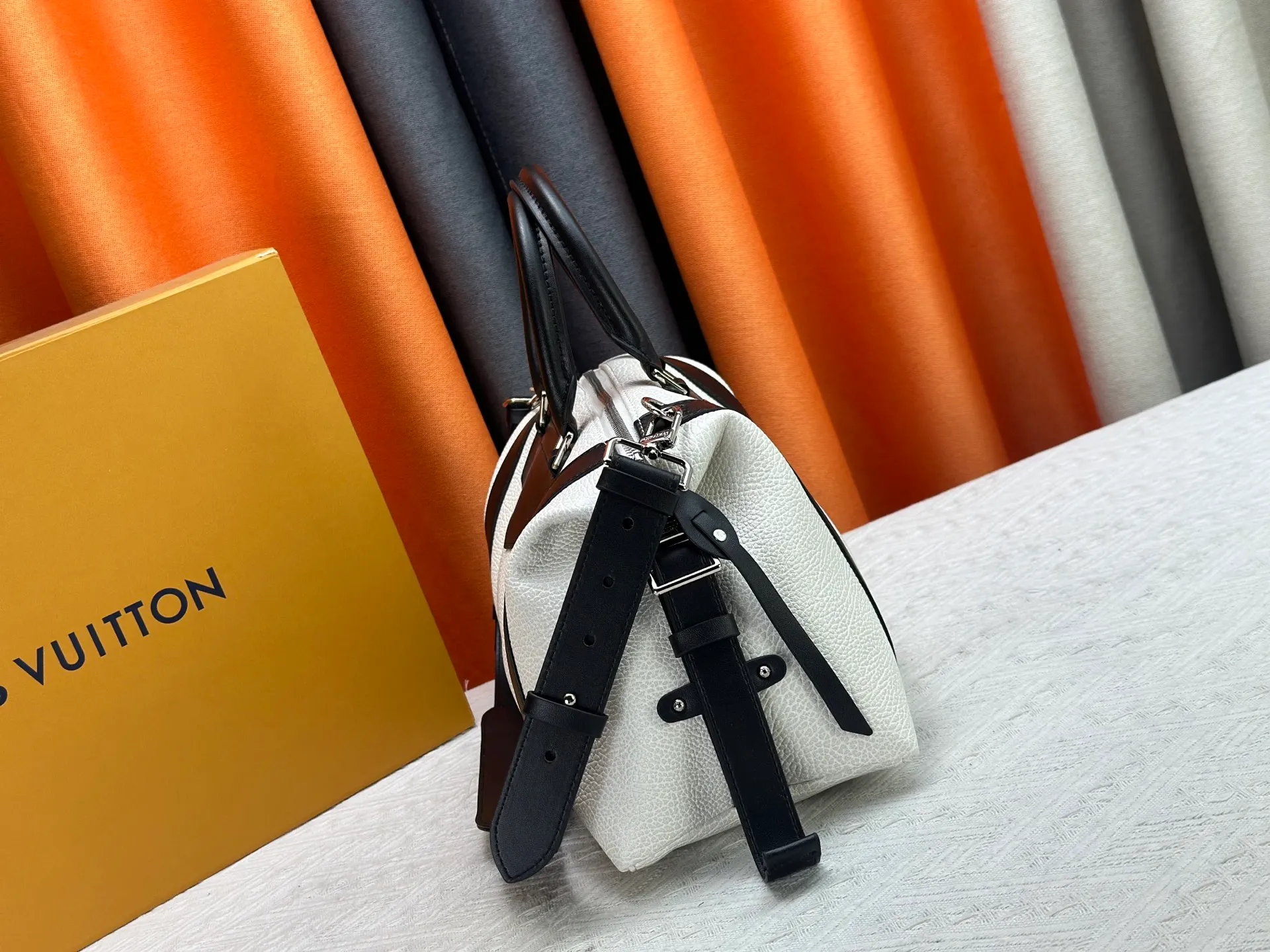 P300 small P320 medium P340 large M25557 M25561 M25561 M25566 Black M14623 mini M14514 small M14700 medium Dark gray M14702 medium Light gray M14721 small This Nano LV Rider handbag is from 2025 For the spring and summer series, pixelated grained sheep leather is blended with smooth cow leather elements, and the LV Circle logo is highlighted with elegant patches. The foldable configuration makes it easy to store in a suitcase, and the modern design adds a rock-n-roll edge to any look.  Mini 10 x 10 x 23 cm Small 12 × 12 × 30 cm Medium 15 × 15 × 38 cm (H x W x L) Sheep leather Cow leather trim Textile lining Metal hardware Zipper closure Side slip straps Internal pocket Holds a 6.7-inch smartphone, Romy card holder and lipstick Shoulder strap: removable, adjustable Strap half-length: 30.0 cm Bag strap half length adjustable to: 45.0 cm Handle: double handle