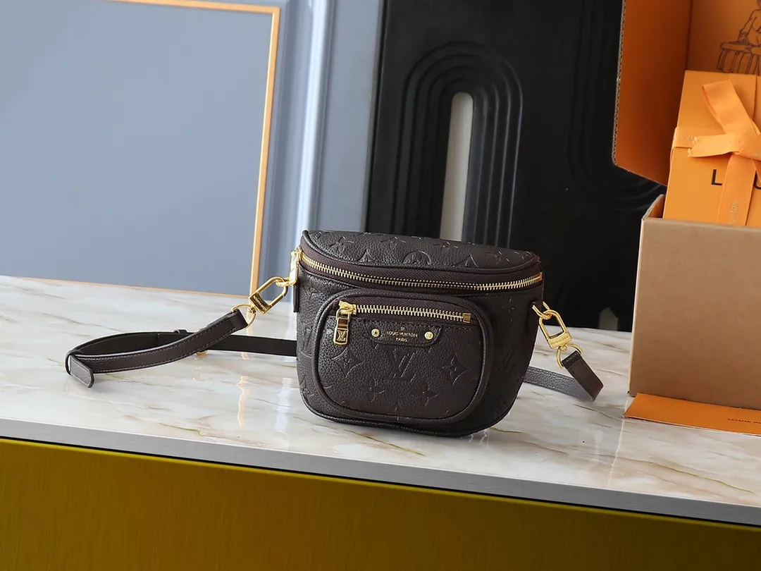 💰200💰Upgraded from the original M46917 M82335 M83275 M82208 M82347 This Mini Bumbag handbag comes from the LV Gradient series and uses the Monogram embossing of Monogram Empreinte leather to render gradient midsummer colors. The on-trend construction features a zipped main compartment and a front pocket with a Louis Vuitton leather label. With the detachable chain and detachable and adjustable shoulder strap, it can be worn as a shoulder or cross-body bag. 17.0 x 12.0 x 9.5 cm (L x H x W) • Monogram Empreinte embossed soft-grained cowhide leather • Textile lining • Metal hardware • Zip closure • Zip front pocket • Shoulder strap: removable, adjustable • Half-length strap: 32.0 cm • Half-length strap adjustable to: 44.0 cm • Chain: Removable • Half-length chain: 20.0 cm