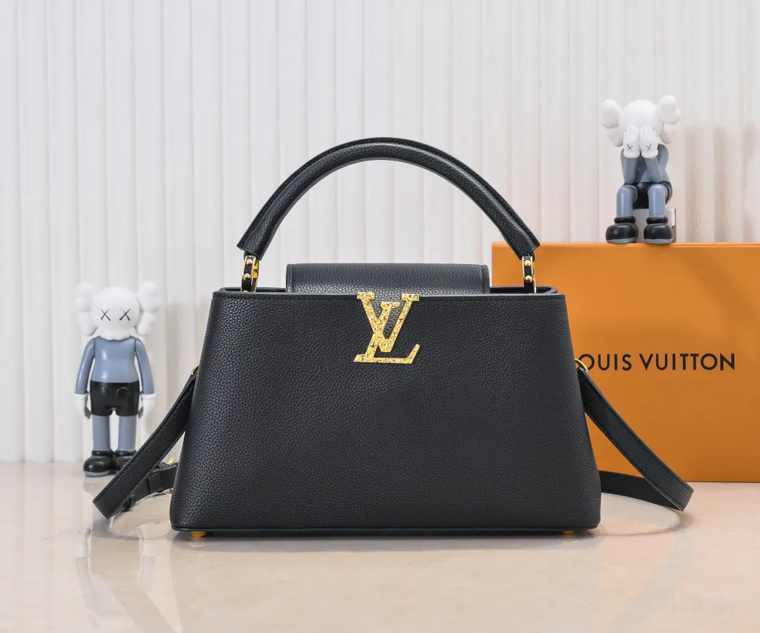 Upgraded version P440 M24664 This medium-sized CapucinesEastWest handbag is from the LVCrush series, with eye-catching forged LV letters lighting up the grained cow leather body. The rolled leather top handle allows for hand or elbow carry, and the adjustable and removable spaghetti strap makes it easy to carry over the shoulder. Personalized Gift Detailed Features 33 x 19 x 9 cm (Length x Height x Width)