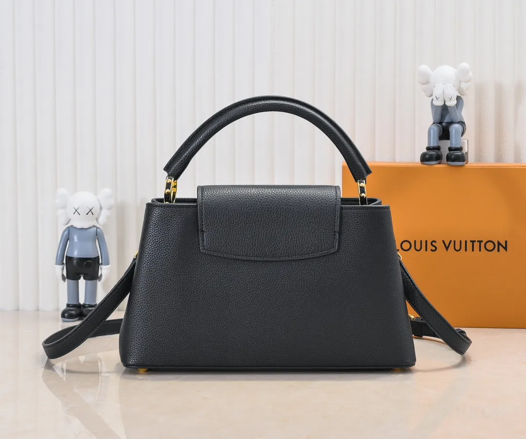 Upgraded version P440 M24664 This medium-sized CapucinesEastWest handbag is from the LVCrush series, with eye-catching forged LV letters lighting up the grained cow leather body. The rolled leather top handle allows for hand or elbow carry, and the adjustable and removable spaghetti strap makes it easy to carry over the shoulder. Personalized Gift Detailed Features 33 x 19 x 9 cm (Length x Height x Width)