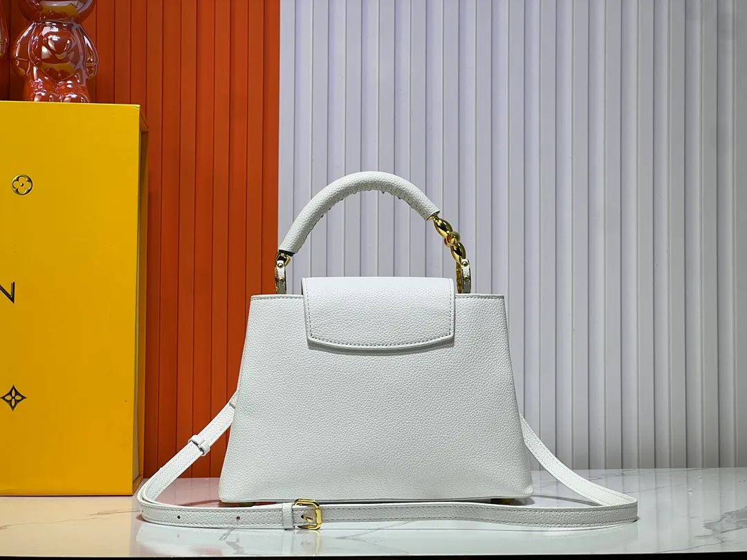Batch 380💰Upgraded original M23943 M23944 M23945 M24698 M24989 This Capucines mini handbag incorporates exquisite Monogram flowers on the handle, presenting the three-dimensional look of the LV logo with delicate brushstrokes, injecting dazzling luster into the soft design. Full-grain Taurillon leather is designed to fit a smartphone, short wallet and other small essentials. Dimensions: Small 21.0 x 14.0 x 8.0 cm (L x H x W) Large 27x 17.5 x 9.0 cm (L x H x W)