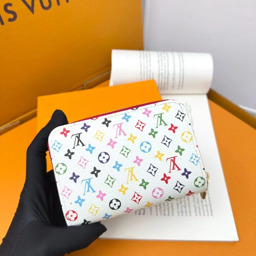 P150 M83689 33 colors This Cléa wallet is made of Monogram Empreinte soft grained cowhide, embellished with Louis Vuitton's iconic Monogram embossed pattern. It has a stylish design, is exquisite and compact but has a spacious capacity. It is equipped with an external patch pocket, zipper coin pocket, banknote compartment and six credit card slots.