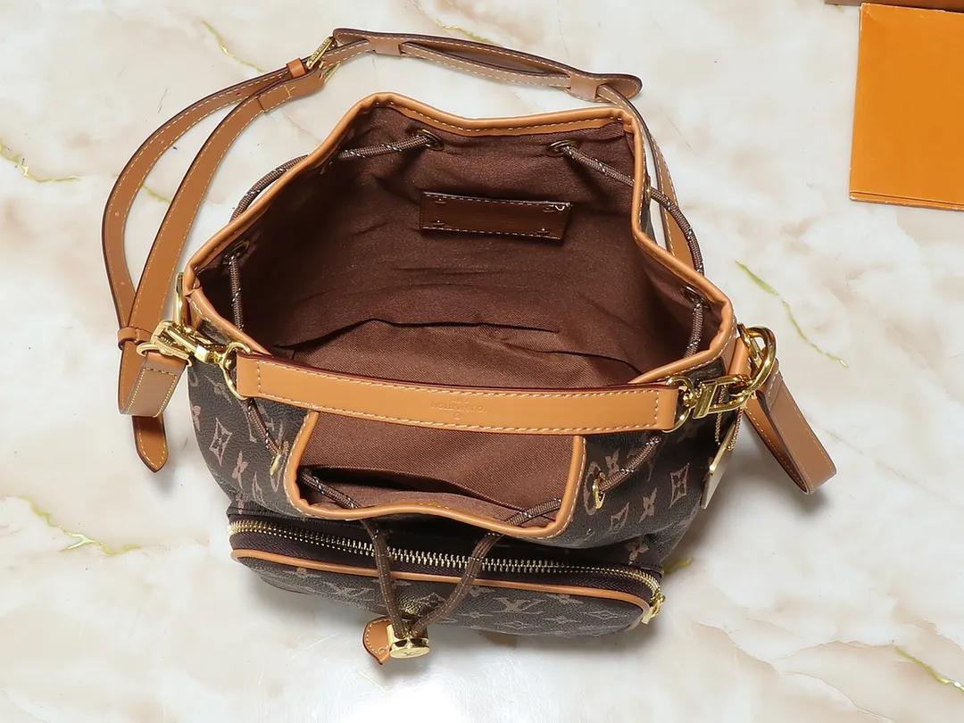 💰Large 130. Small 240💰Upgraded from the original M14199 M14017 Noe Cargo is a compact bucket bag made of glossy cow leather, showing a nylon-like technological luster, and is lined with deep-toned fabric. Metal parts, including the LV letters attached to a ball chain, are the only color-coordinated elements on this monochromatic bag. Roomy front pocket inside. ·Cow leather trim fabric lined with hardware Drawstring and metal closure main compartment LV pendant zipper pull Pearl rivets Louis Vuitton Paris patch ·Zip front pocket Shoulder strap: Removable, adjustable strap Half length: 40.0 cm Small size: 24✘22✘16cm Large size: 28✘22✘16cm (H✘L✘W)