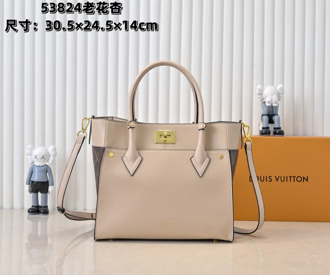 💰360💰Upgraded original [M53826 black embroidery M53825 apricot embroidery M53824 MM53823 presbyopia with black]🔥On My Side handbag shows the elegant fusion of calfskin and classic Monogram canvas. Contrasting canvas shapes the large outer pocket, creating a trompe l'oeil effect as if two handbags merge into one. Plenty of space can easily accommodate office needs, and the adjustable shoulder strap allows for a cross-body style. Dimensions: 30.5 x 24.5 x 14 cm (Length x Height x Width) - Calfskin and Monogram coated canvas - Cowhide leather trim - Microfiber lining - 2 top handles for hand or elbow carry - Adjustable shoulder strap for shoulder or cross-body wear - Lock closure - 2 outer pockets with magnetic closure - Zip pocket - 1 patch pocket