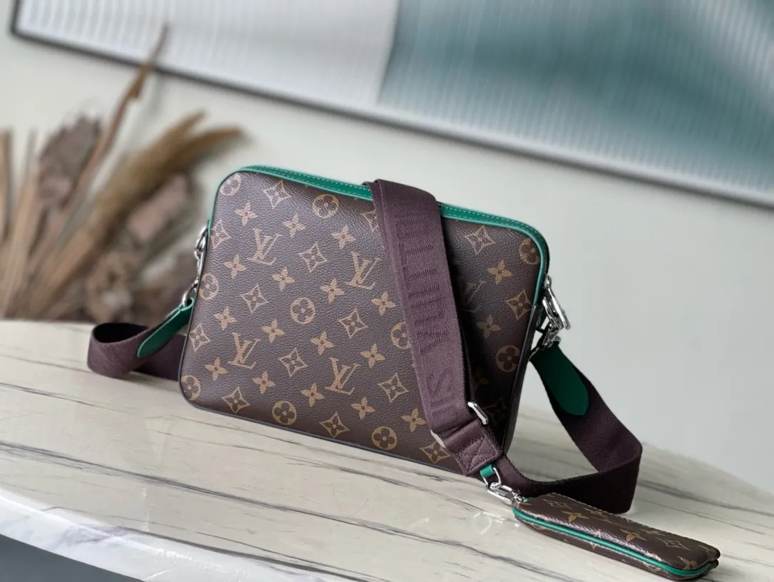 💰800 Top Original Order M12766 This Trio messenger bag is made of Monogram Macassar coated canvas, and then uses bright cow leather to outline the edges and other details. The main compartment and removable zippered front pocket provide storage, and the removable small coin purse secures via the shoulder strap's D-ring. Dimensions: 25 × 18.5 × 7cm