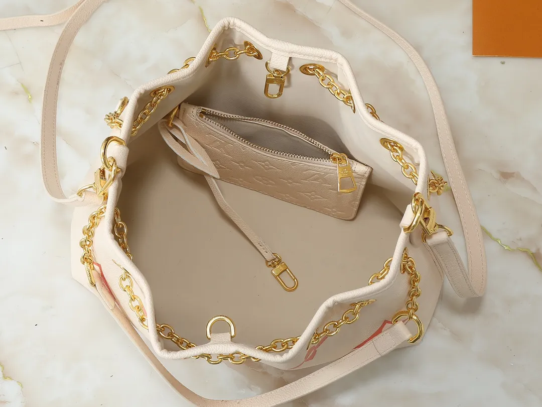 💰260💰Upgraded original version ✨M11283 M25453 M47209 M46545 M46492 This Summer Bundle handbag is from the Dégradé series. The new drawstring design adds a summer atmosphere. The Monogram Empreinte embossed leather bag features a gradient tone to brighten any seasonal look. The double handles and detachable cross-body strap provide a variety of stylish carrying options, making it a great companion for travel day and night. Detailed features: 28 x 20 x 11.5 (Length x Height x Width)
