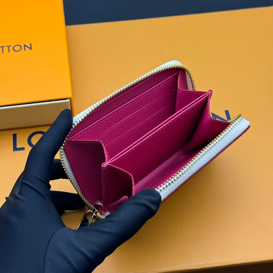 💰110 💎Premium Original 🇫🇷 LV x TM Zippy Coin Purse Black (Three Colors - Takashi Murakami) As part of the Louis Vuitton x Murakami collection reissue, the timeless Zippy Coin Purse is practical and playful, upgraded for this season. It's made from Monogram coated canvas in a cheerful rainbow of hues, in keeping with the Japanese artist's signature pop palette. The interior is secured with a silver zipper and is divided into multiple compartments for coins, banknotes and cards. Model: M13409 Dimensions: 11 x 8.5 x 2 cm.