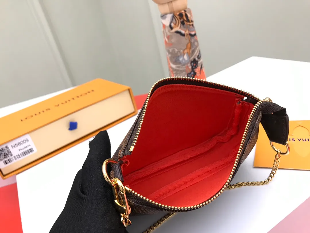 Factory price 240 [Top original order] N58009 Brown 👏👏 This accessory bag opens with a zipper and comes with a gold chain, which can be attached to the D-ring on most Louis Vuitton handbags. Size: 15.5x10.5x4.0cm, packaging: with box