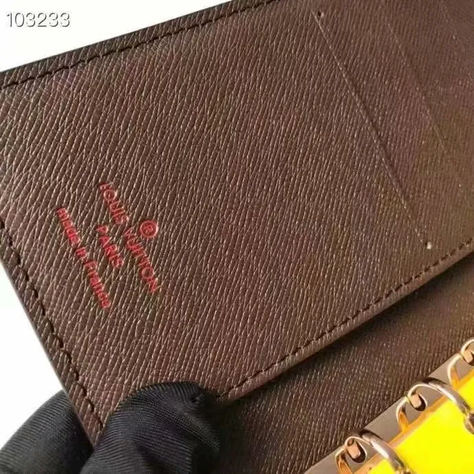 P140 Hot item shipped, model number M20005. This small notepad cover is made of Monogram canvas. It can hold three credit cards and can also be used as an address book, notebook or calendar. 10/12 cm (Length x Height) - Epi leather embossed with delicate LV initials and lined with interwoven textured leather - Button closure - Six-ring binder with three rings in sets, six credit card slots and two internal compartments - Notepad insert available separately