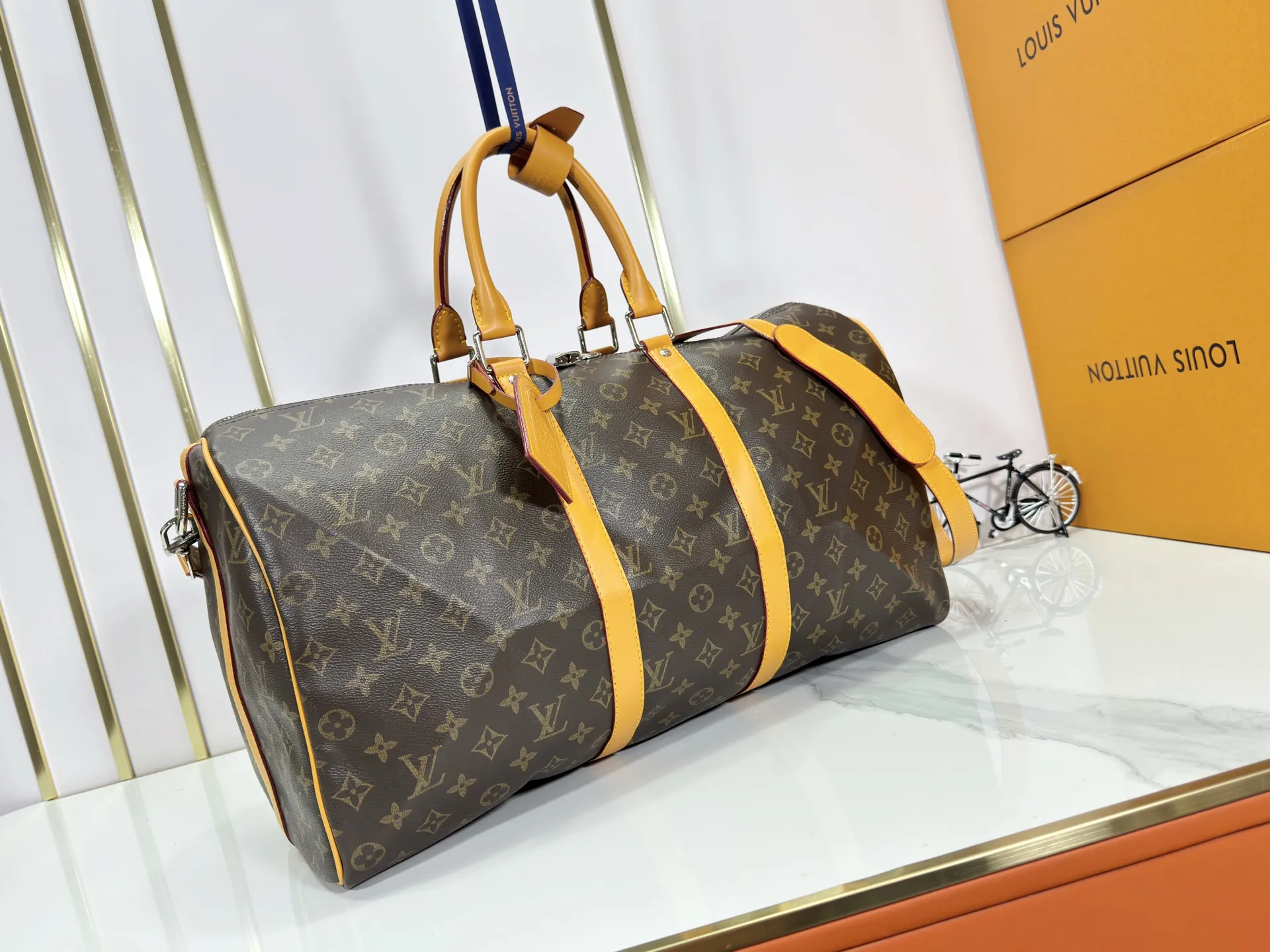 P360 Upgraded Original M41416 M12634 Yellow M12633 Dark Blue M12629 Light Blue M12630 Dark Green Top Original This Keepall Bandoulière 50 travel bag is made of Monogram Macassar canvas, which simultaneously renders bright colors for the side straps, nameplate, fabric lining and top leather handle. The size of your carry-on luggage hides plenty of space. 50.0 x 29.0 x 23.0 cm (L x H x W) • Monogram Macassar coated canvas • Cow leather trim • Textile lining • Metal hardware • Carry-on dimensions • Double zipper closure • Padlock • Removable name tag • Internal zip pocket • Shoulder strap: removable, adjustable • Half-length strap: 36.0 cm • Half-length strap adjustable to: 50.0 cm • Handle: Double handle