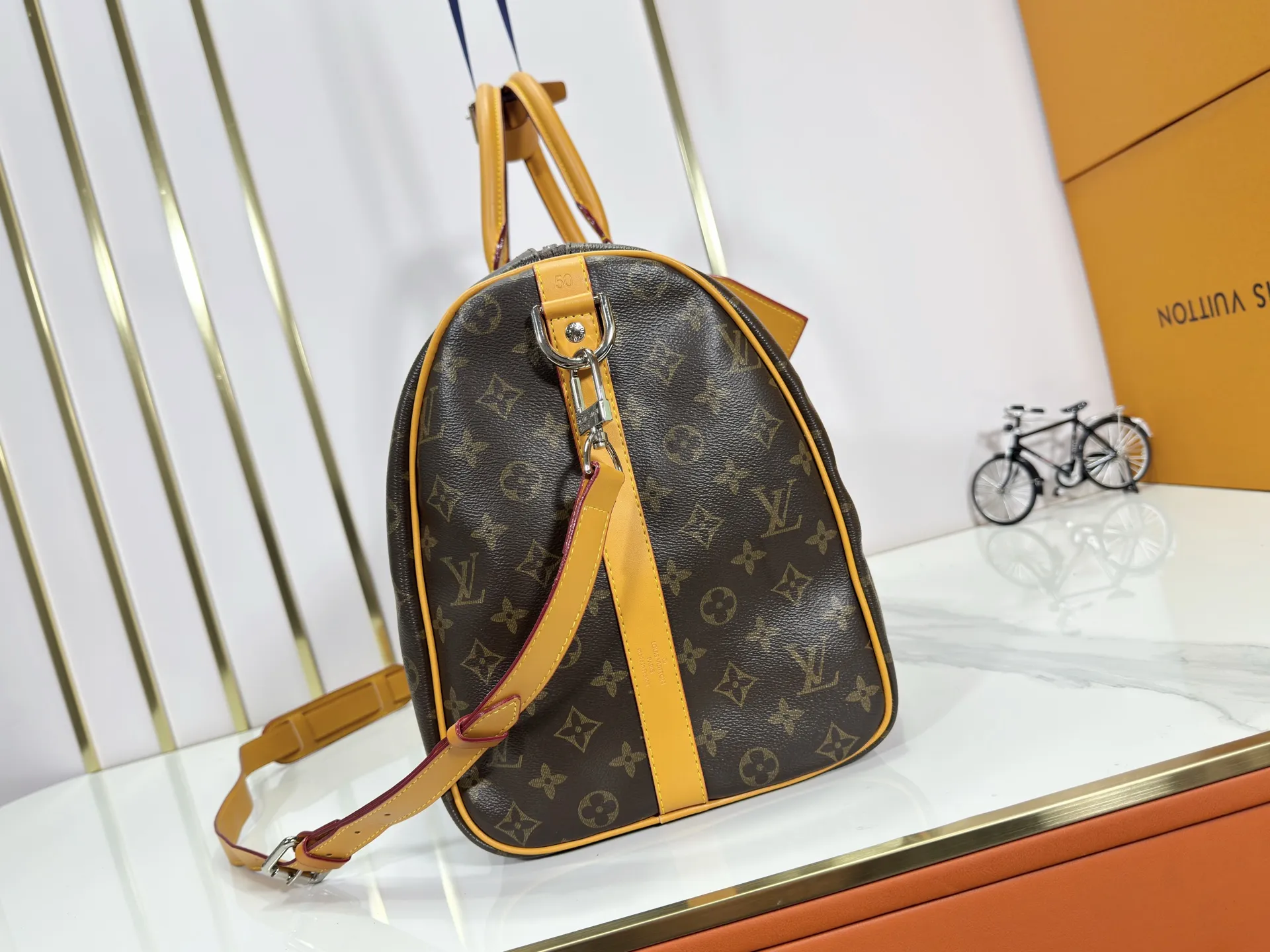 P360 Upgraded Original M41416 M12634 Yellow M12633 Dark Blue M12629 Light Blue M12630 Dark Green Top Original This Keepall Bandoulière 50 travel bag is made of Monogram Macassar canvas, which simultaneously renders bright colors for the side straps, nameplate, fabric lining and top leather handle. The size of your carry-on luggage hides plenty of space. 50.0 x 29.0 x 23.0 cm (L x H x W) • Monogram Macassar coated canvas • Cow leather trim • Textile lining • Metal hardware • Carry-on dimensions • Double zipper closure • Padlock • Removable name tag • Internal zip pocket • Shoulder strap: removable, adjustable • Half-length strap: 36.0 cm • Half-length strap adjustable to: 50.0 cm • Handle: Double handle