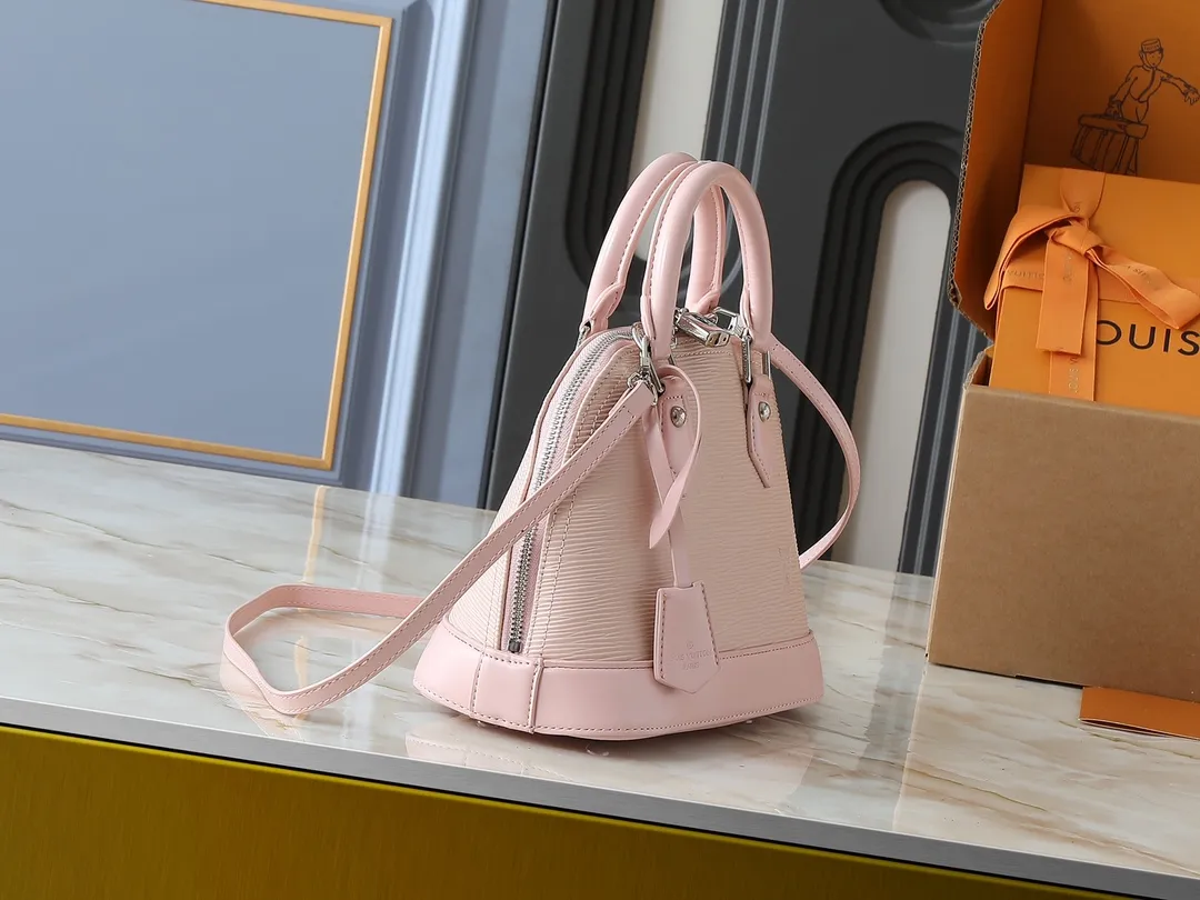 💰240💰Upgraded original M41160 M41327 M40855 M40862 M53152 This Alma BB handbag is based on a classic Louis Vuitton bag designed in 1934 with an Art Deco style. In 2010, on the occasion of the 20th anniversary of the official launch of the Alma bag, a mini model was specially designed for the daughter of the woman who owns this bag. The Alma BB bag features a removable shoulder strap for lightweight cross-body wear. A new and stylish take on a classic shape, this bag in Epi leather is available in a range of bright, vibrant colors. Size: 25×19×12cm