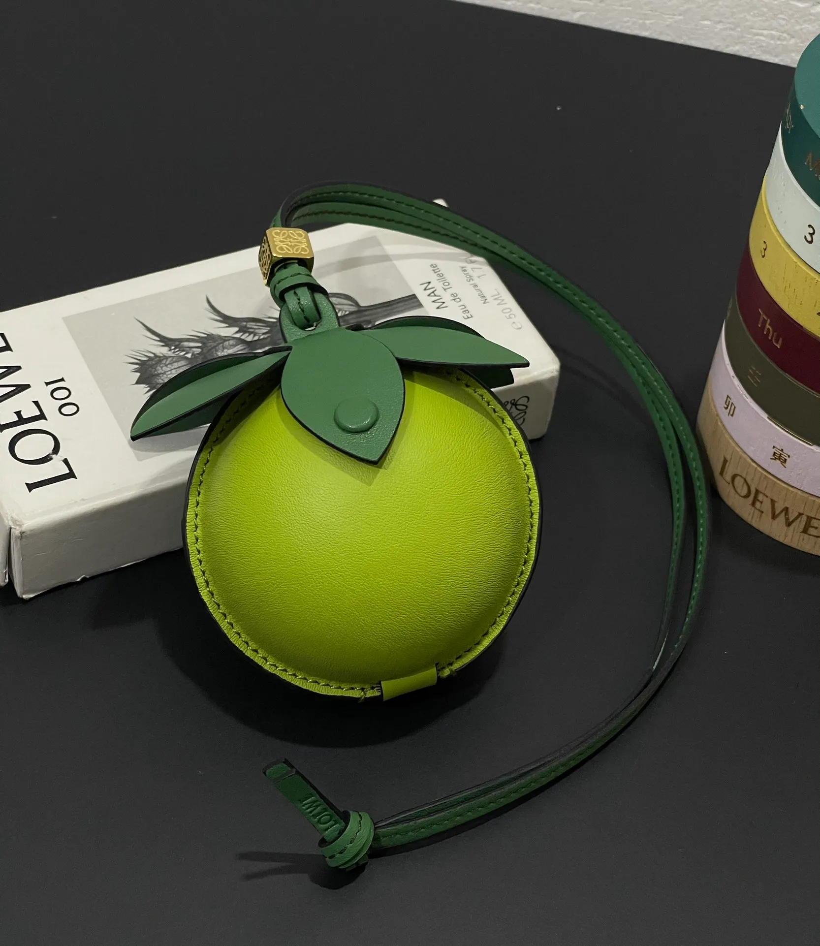 💰880 Big Lime 🍋 Small bag pendant is made of calfskin with contrasting colors and fastened with snap buttons. It can hold some small items and change inside, and can be hung on the neck or bag.    Style No. 327 Size 12*11 (cards cannot be placed)