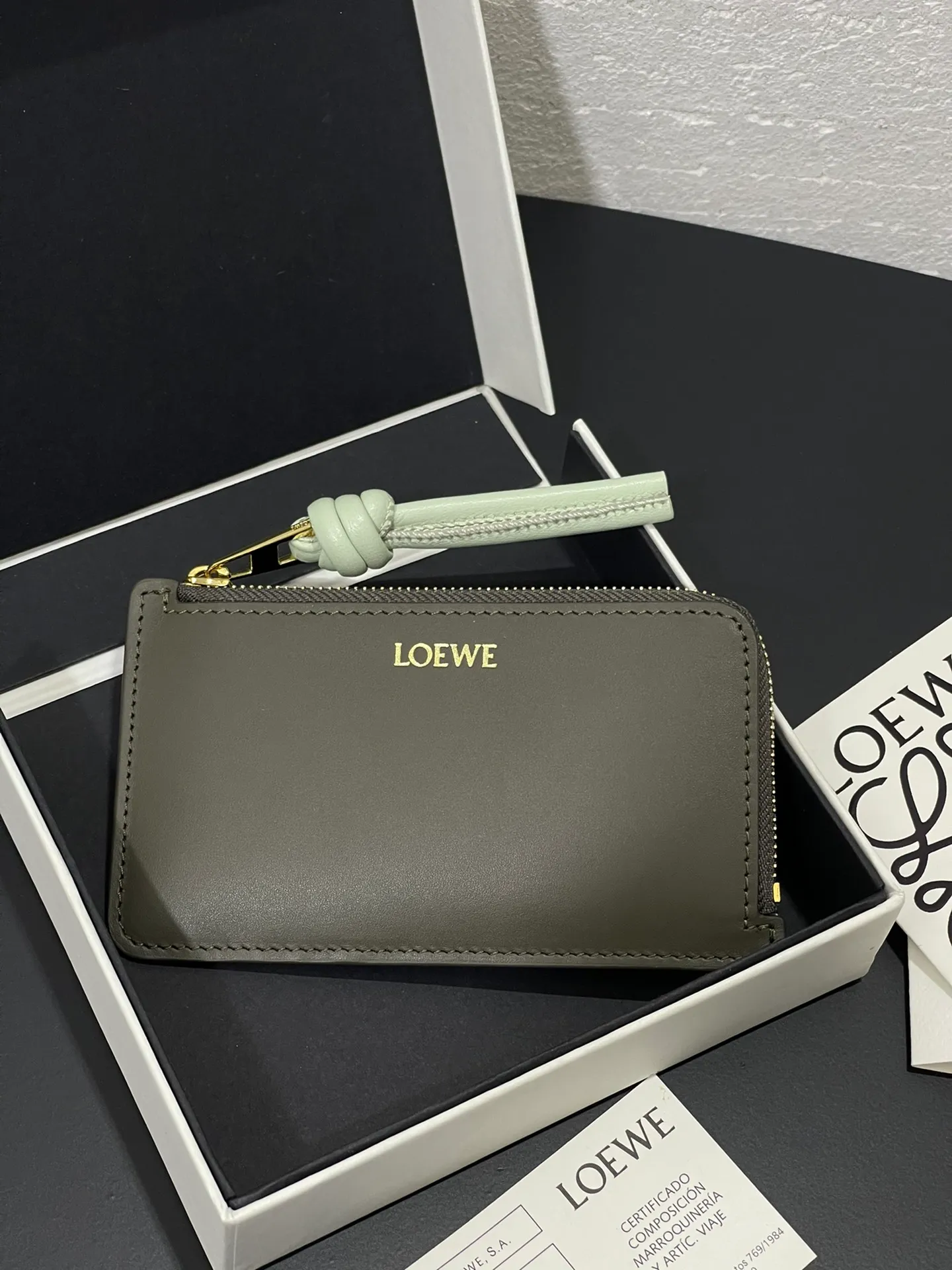 Satin nappa cowhide knot zipper small card holder, sheepskin lining, color-blocked knot pull tab, four card slots and zipper compartment. Style number 3793, size 13.5✕7 💰300