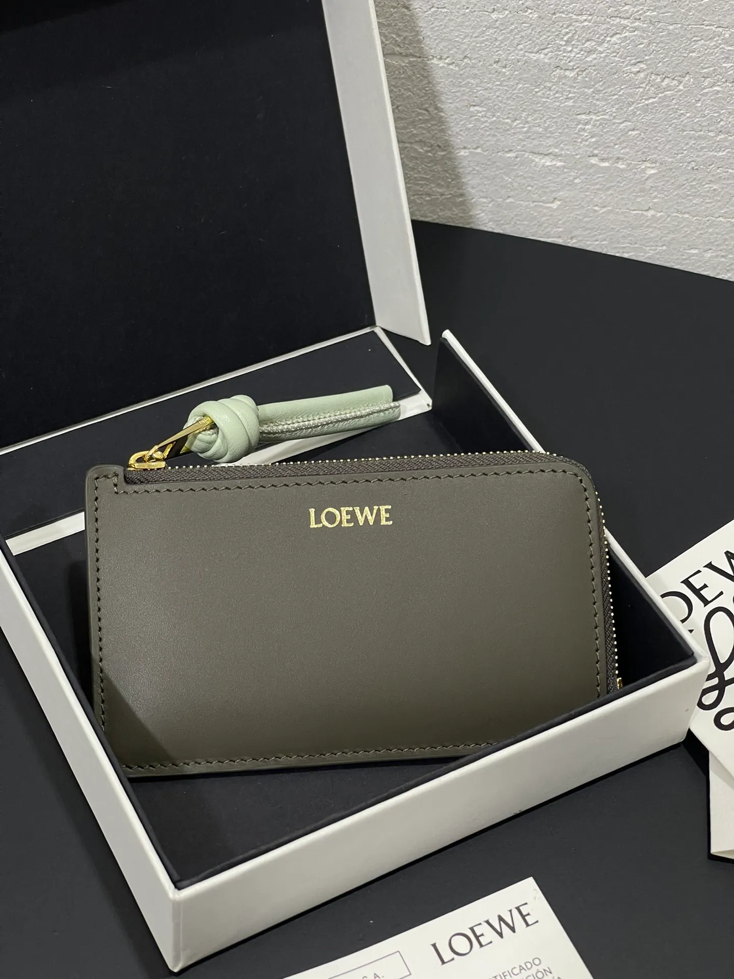 Satin nappa cowhide knot zipper small card holder, sheepskin lining, color-blocked knot pull tab, four card slots and zipper compartment. Style number 3793, size 13.5✕7 💰300