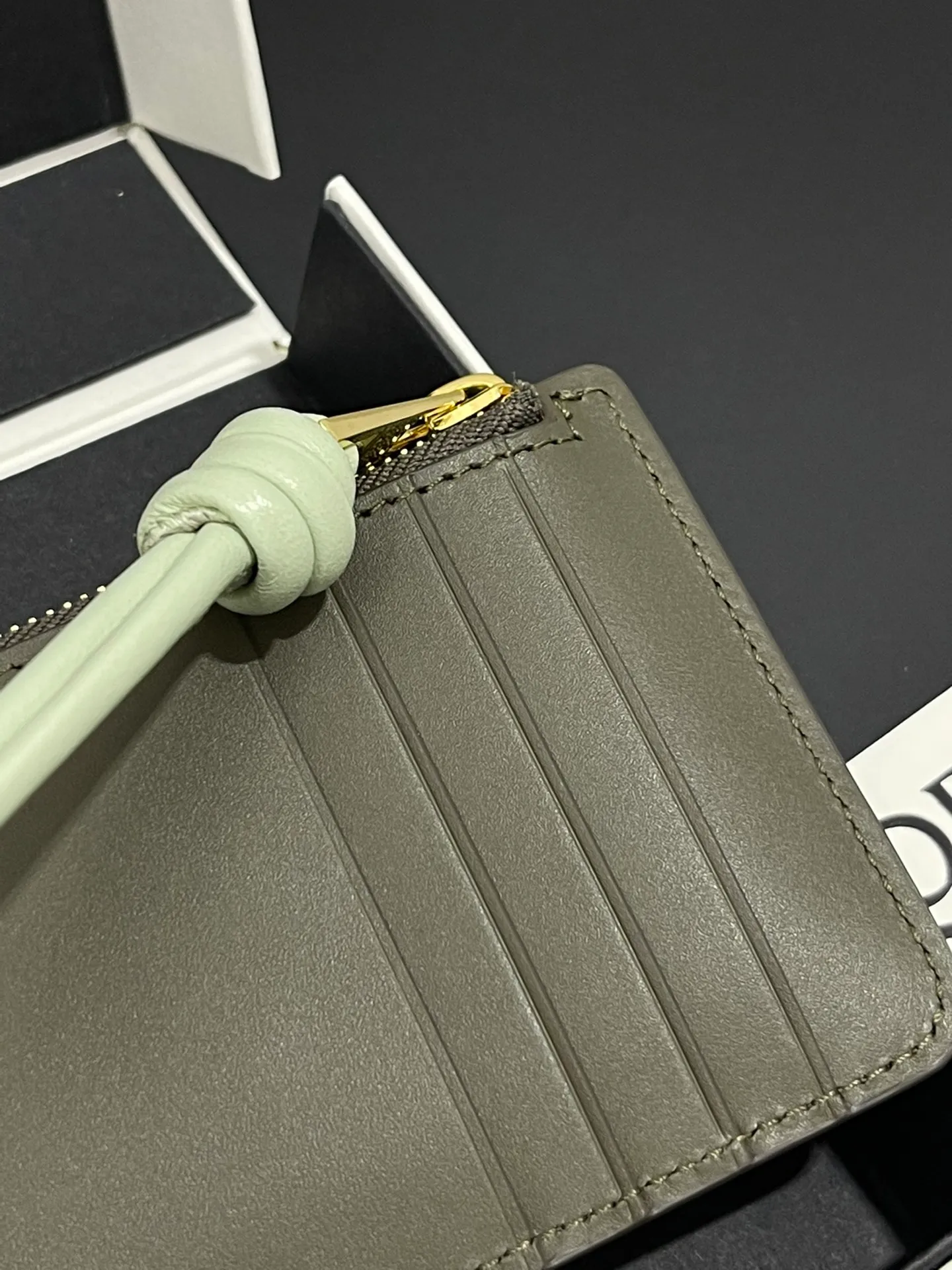 Satin nappa cowhide knot zipper small card holder, sheepskin lining, color-blocked knot pull tab, four card slots and zipper compartment. Style number 3793, size 13.5✕7 💰300
