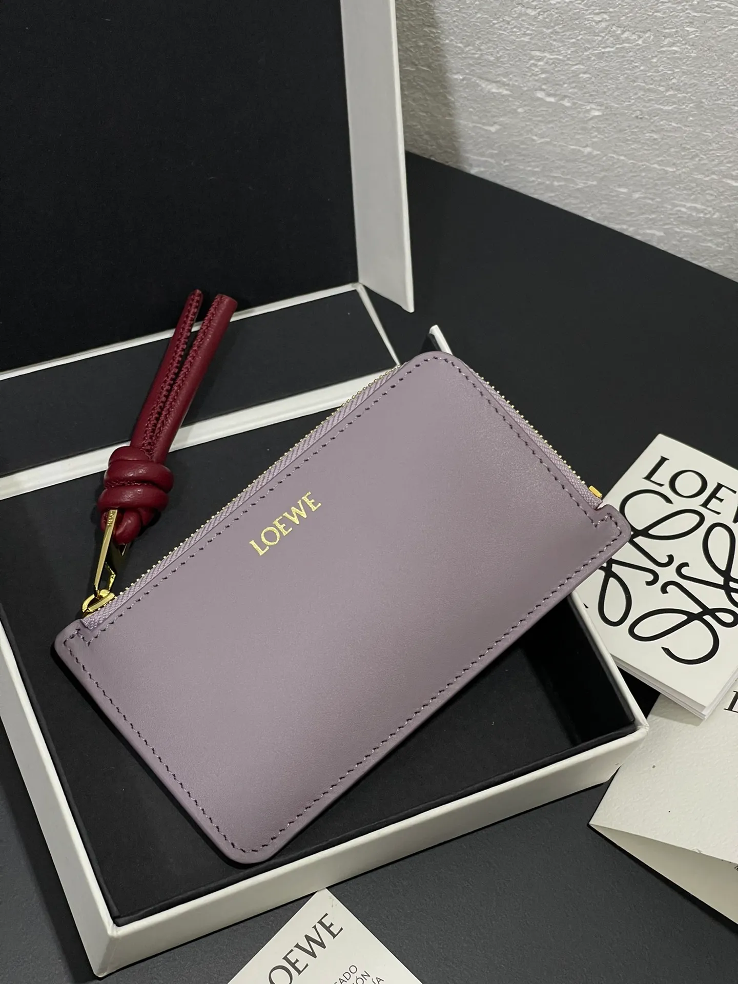 Satin nappa cowhide knot zipper small card holder, sheepskin lining, color-blocked knot pull tab, four card slots and zipper compartment. Style number 3793, size 13.5✕7 💰300