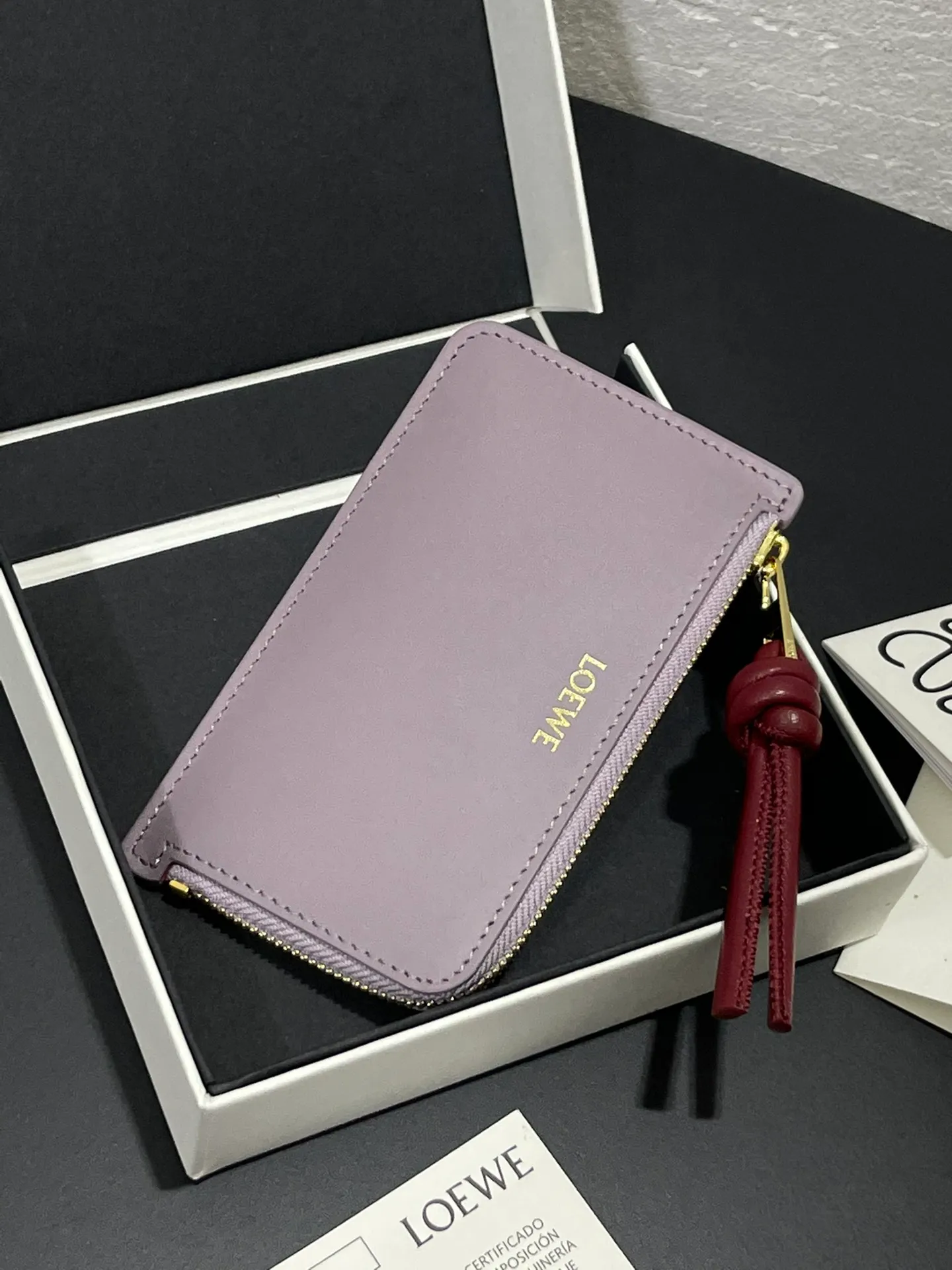 Satin nappa cowhide knot zipper small card holder, sheepskin lining, color-blocked knot pull tab, four card slots and zipper compartment. Style number 3793, size 13.5✕7 💰300