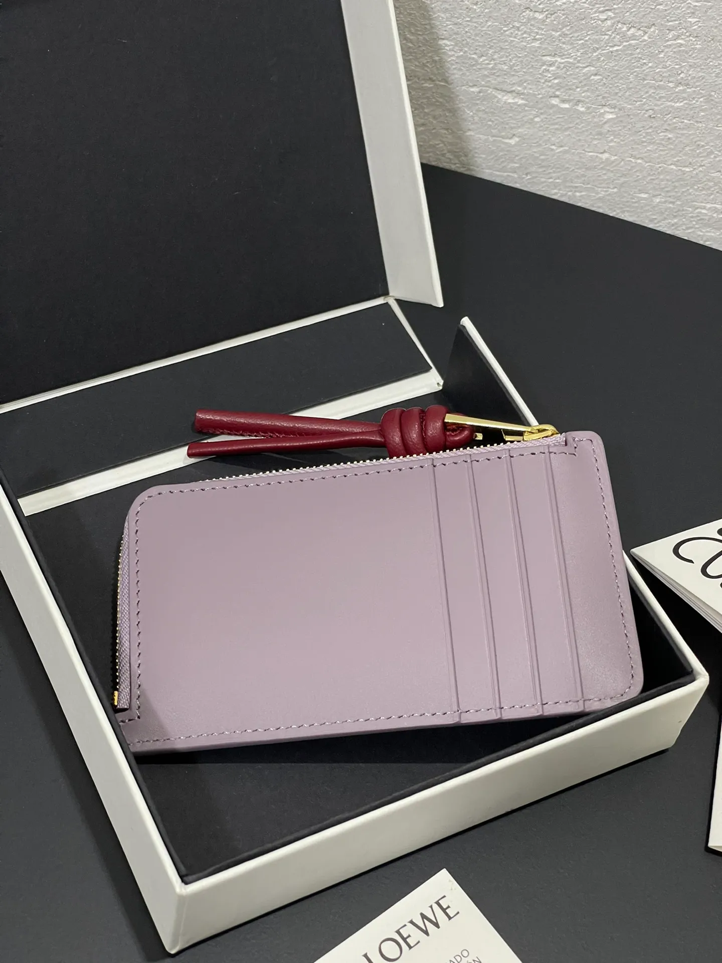Satin nappa cowhide knot zipper small card holder, sheepskin lining, color-blocked knot pull tab, four card slots and zipper compartment. Style number 3793, size 13.5✕7 💰300