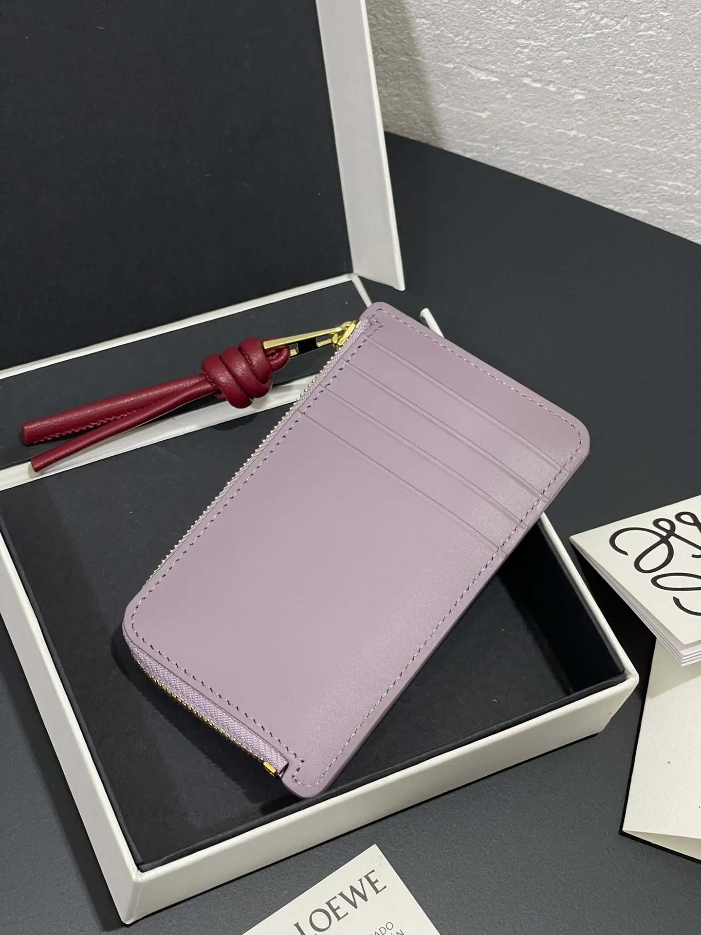 Satin nappa cowhide knot zipper small card holder, sheepskin lining, color-blocked knot pull tab, four card slots and zipper compartment. Style number 3793, size 13.5✕7 💰300