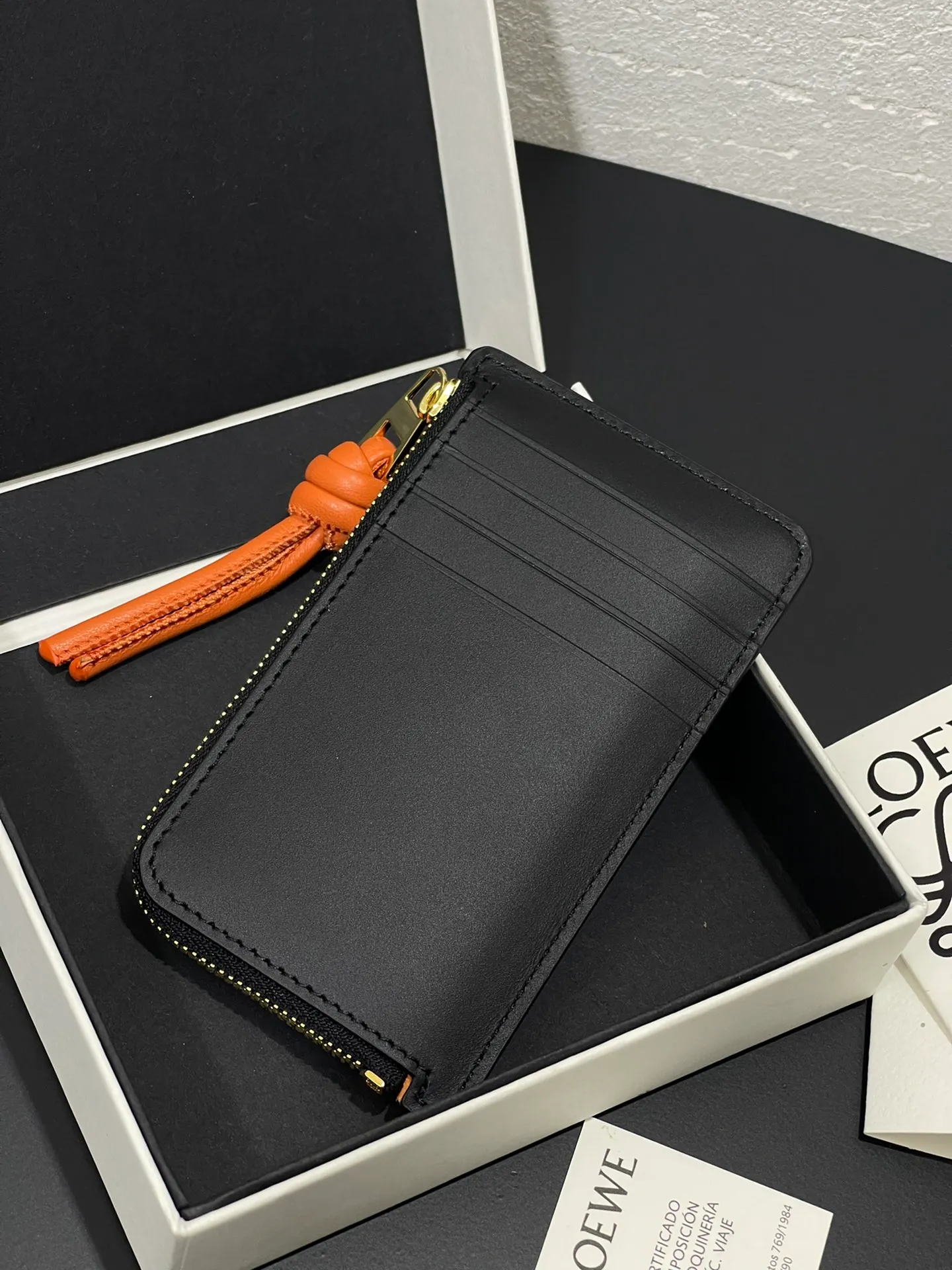 Satin nappa cowhide knot zipper small card holder, sheepskin lining, color-blocked knot pull tab, four card slots and zipper compartment. Style number 3793, size 13.5✕7 💰300