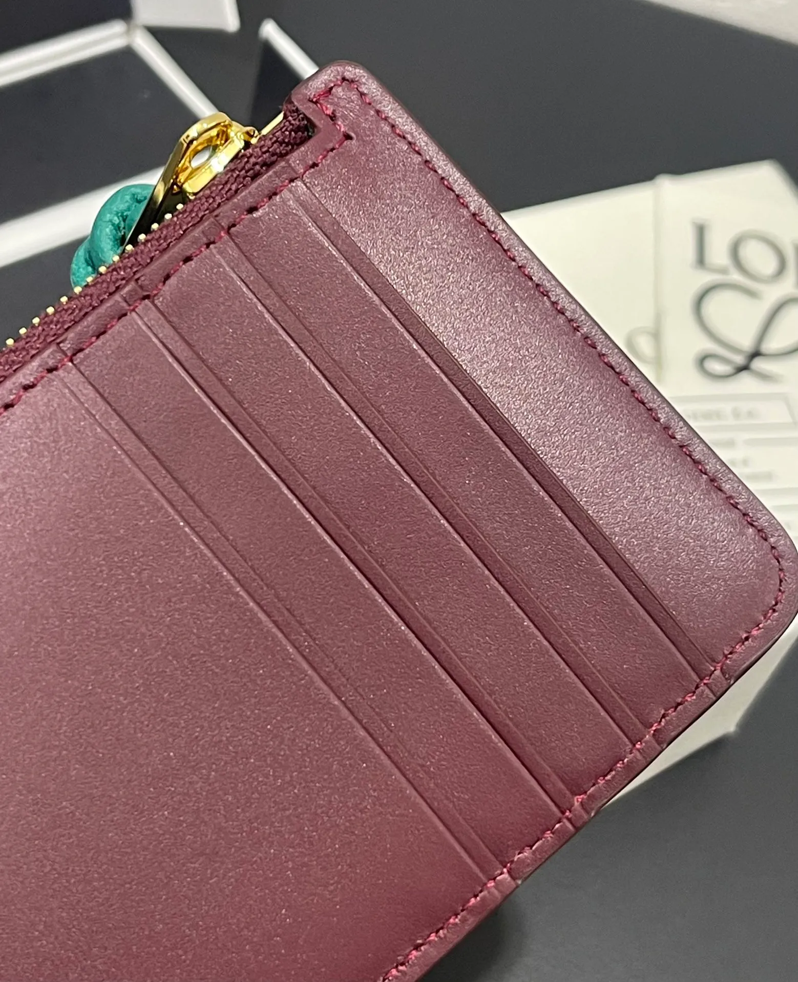 Satin nappa cowhide knot zipper small card holder, sheepskin lining, color-blocked knot pull tab, four card slots and zipper compartment. Style number 3793, size 13.5✕7 💰300