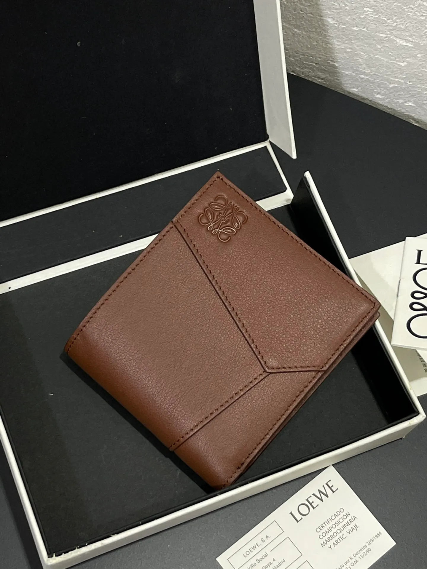 Men's bifold wallet is shipped. The wallet is inspired by the puzzle series handbags. It adopts a unique geometric pattern. It is made of classic calfskin. It has eight card slots and two large pockets. Style number 3801. Size 11*10 💰330