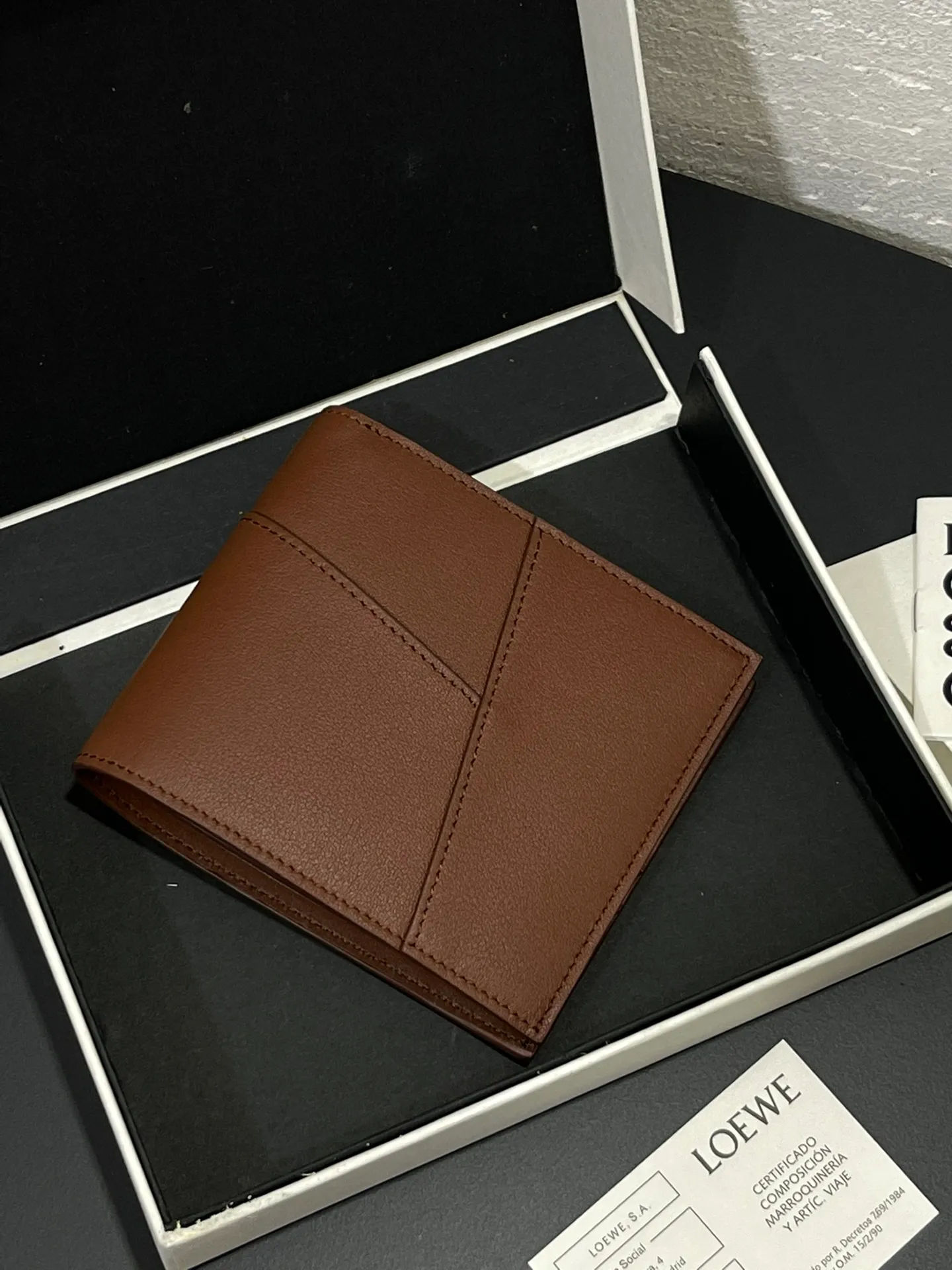 Men's bifold wallet is shipped. The wallet is inspired by the puzzle series handbags. It adopts a unique geometric pattern. It is made of classic calfskin. It has eight card slots and two large pockets. Style number 3801. Size 11*10 💰330