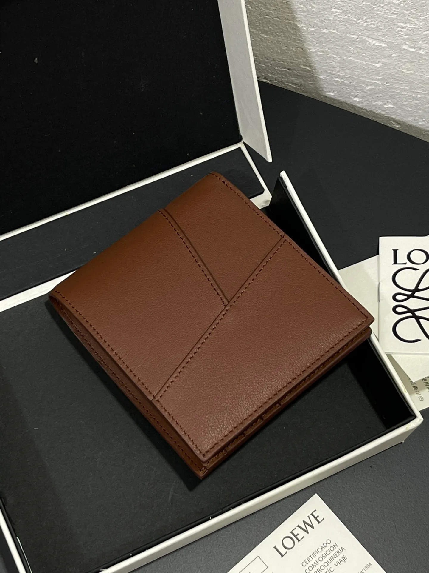 Men's bifold wallet is shipped. The wallet is inspired by the puzzle series handbags. It adopts a unique geometric pattern. It is made of classic calfskin. It has eight card slots and two large pockets. Style number 3801. Size 11*10 💰330
