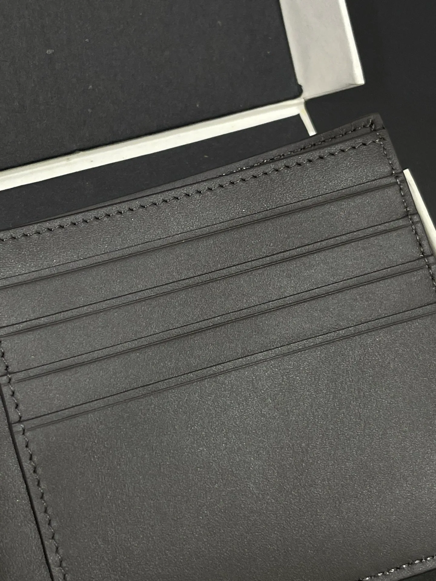 Men's bifold wallet is shipped. The wallet is inspired by the puzzle series handbags. It adopts a unique geometric pattern. It is made of classic calfskin. It has eight card slots and two large pockets. Style number 3801. Size 11*10 💰330