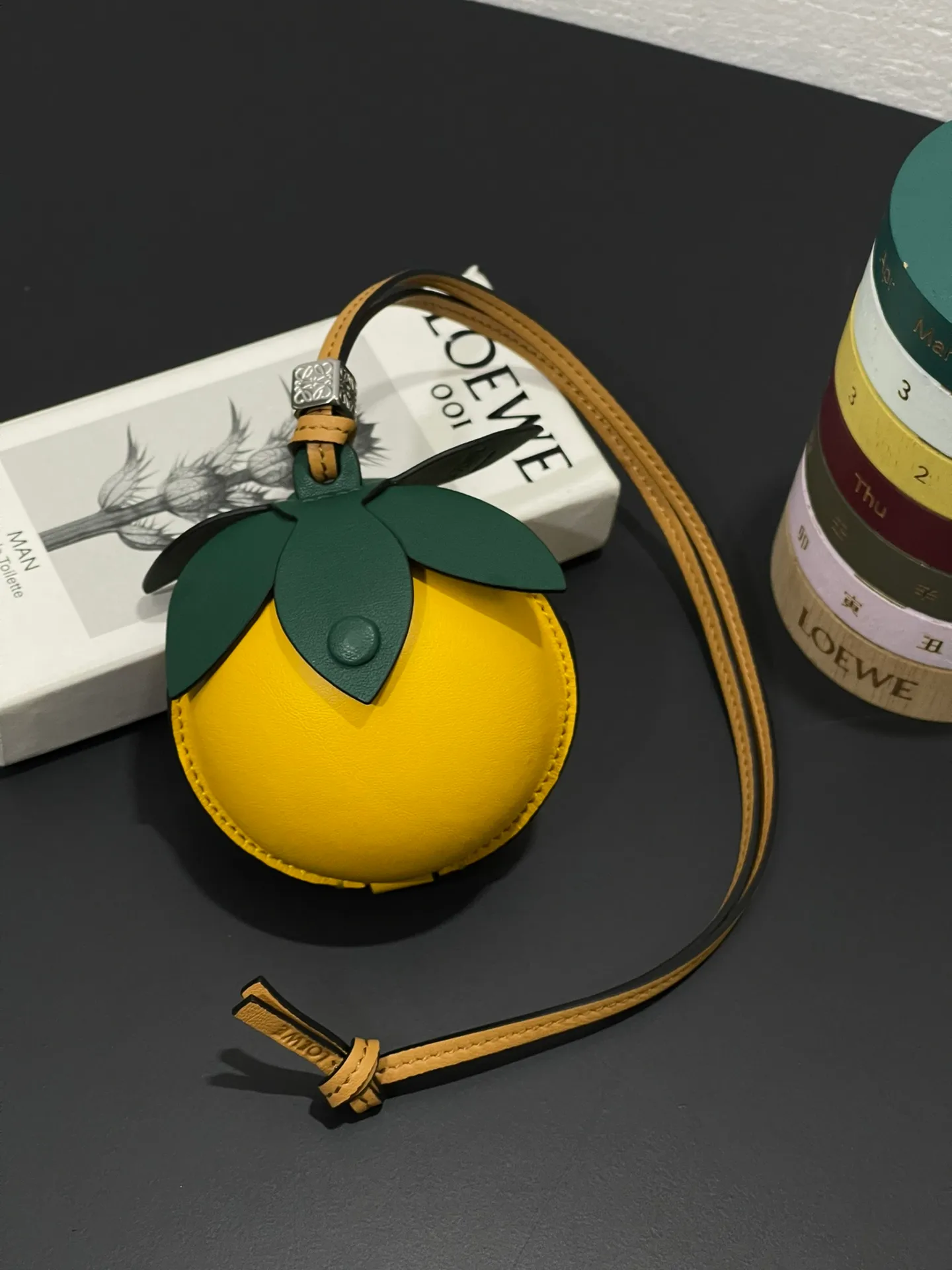 💰880 Passion fruit small bag pendant is made of calfskin with contrasting colors and fastened with snap buttons. It can hold some small items and change inside, and can be hung on the neck or bag.    Style No. 327 Size 12*11 (cards cannot be placed)