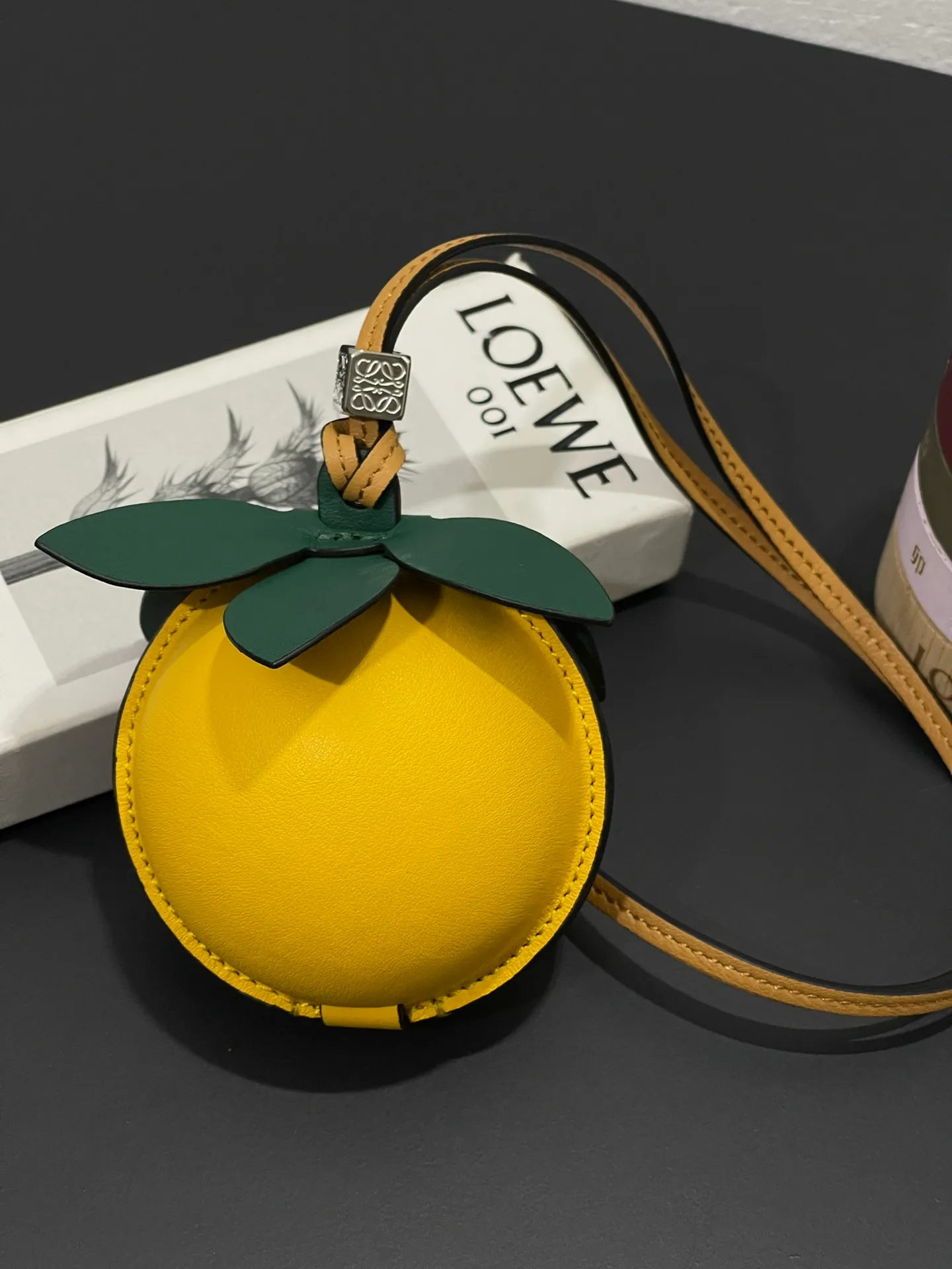 💰880 Passion fruit small bag pendant is made of calfskin with contrasting colors and fastened with snap buttons. It can hold some small items and change inside, and can be hung on the neck or bag.    Style No. 327 Size 12*11 (cards cannot be placed)