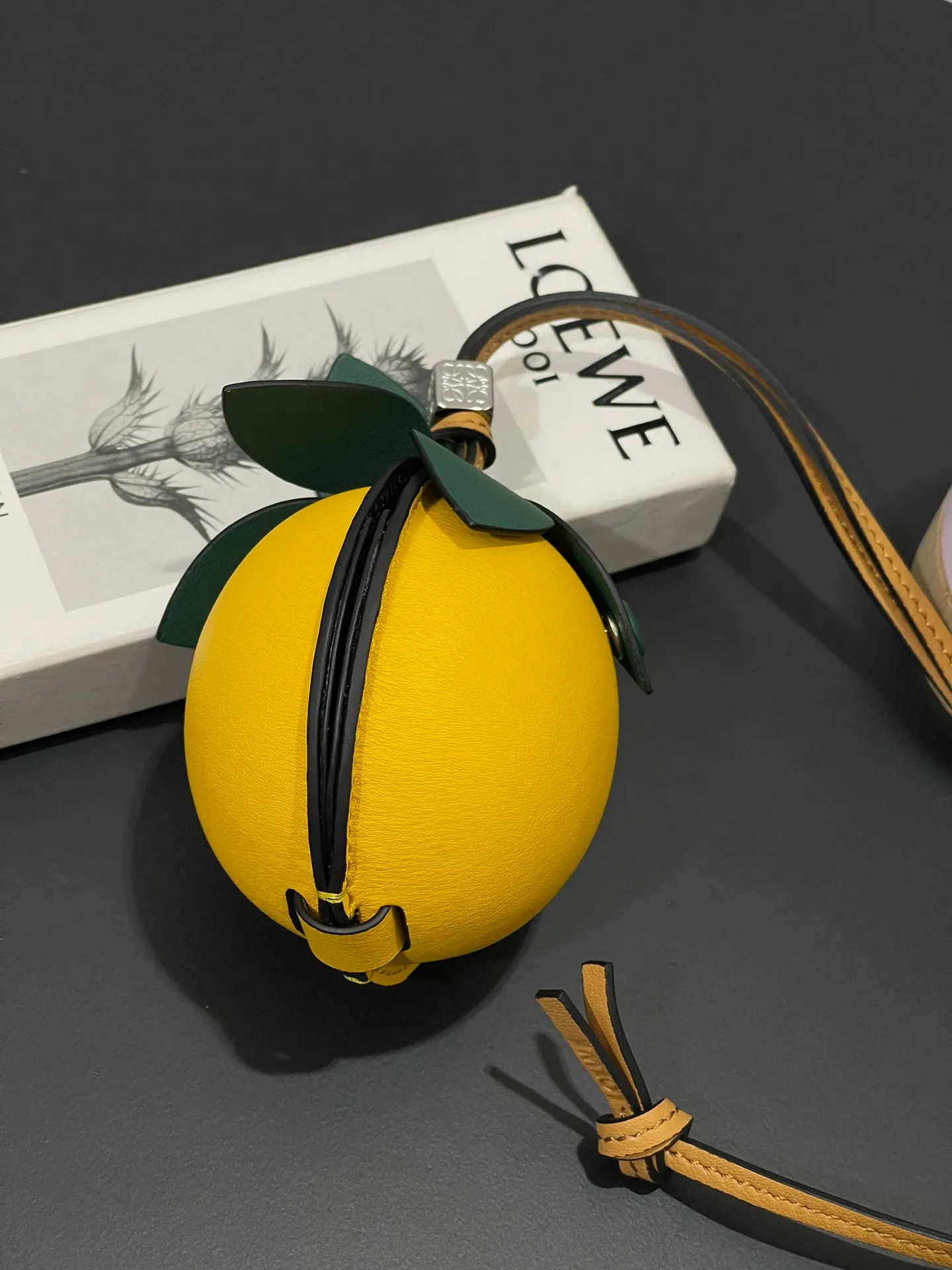 💰880 Passion fruit small bag pendant is made of calfskin with contrasting colors and fastened with snap buttons. It can hold some small items and change inside, and can be hung on the neck or bag.    Style No. 327 Size 12*11 (cards cannot be placed)