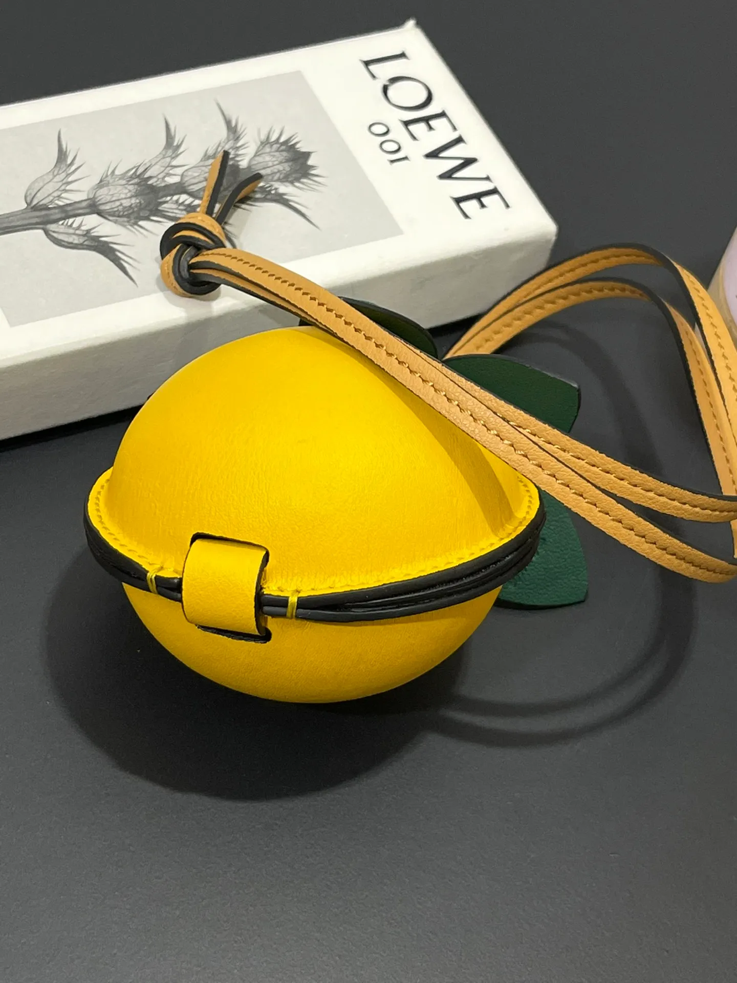💰880 Passion fruit small bag pendant is made of calfskin with contrasting colors and fastened with snap buttons. It can hold some small items and change inside, and can be hung on the neck or bag.    Style No. 327 Size 12*11 (cards cannot be placed)